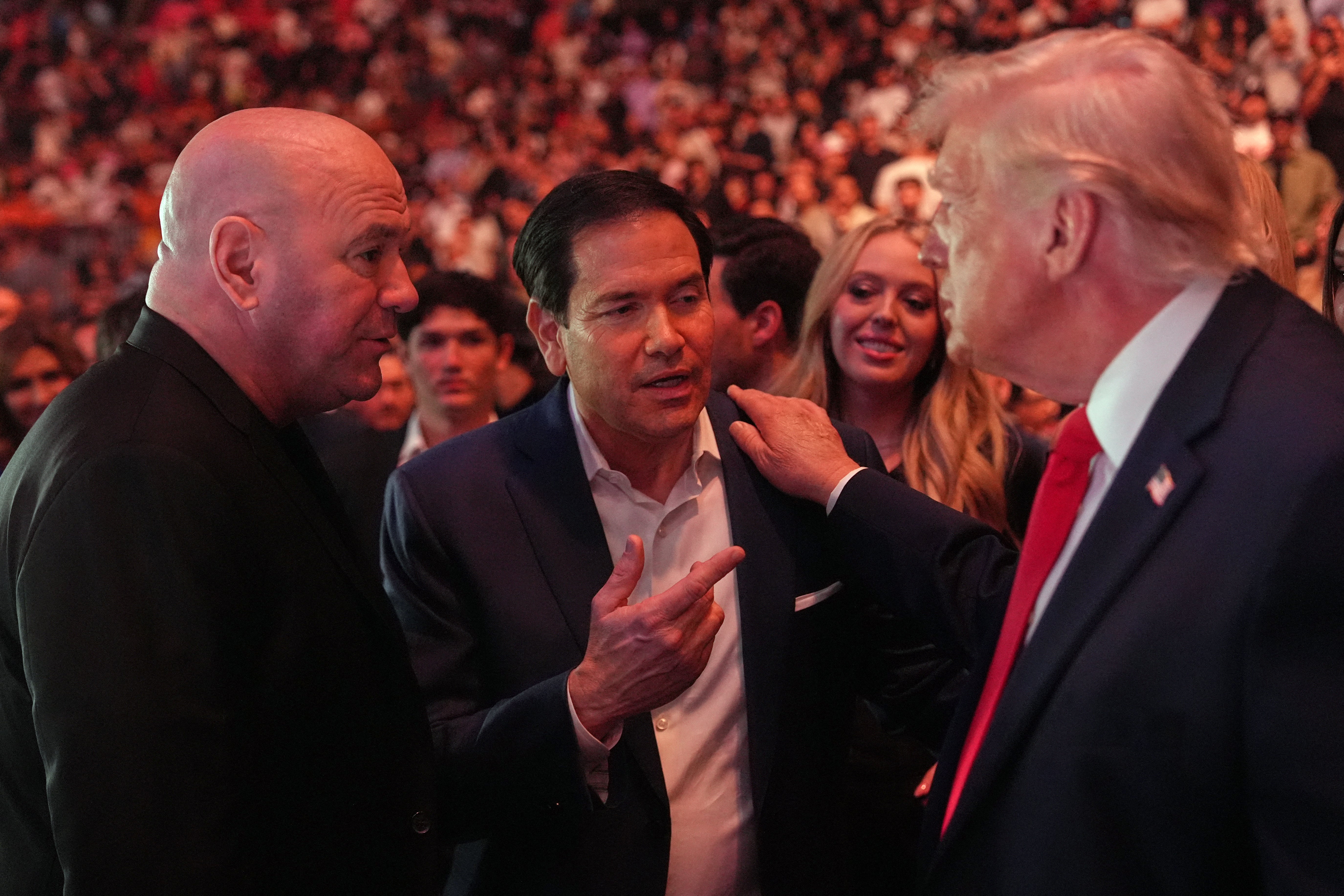 Mr Trump with UFC president Dana White (left) and US Secretary of State Marco Rubio at UFC 327 in April