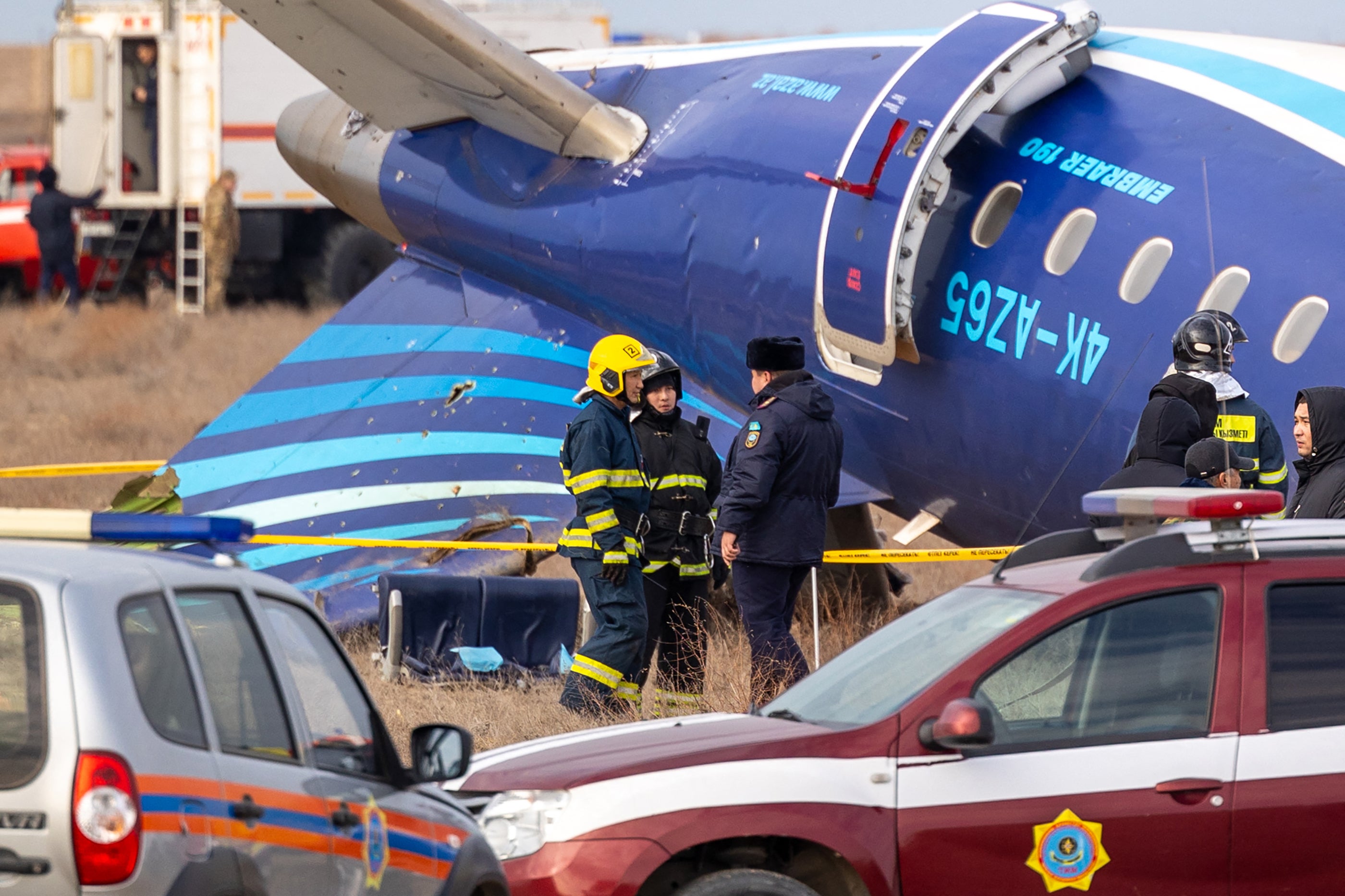 Emergency specialists work at the crash site of an Azerbaijan Airlines passenger jet near the western Kazakh city of Aktau on December 25, 2024