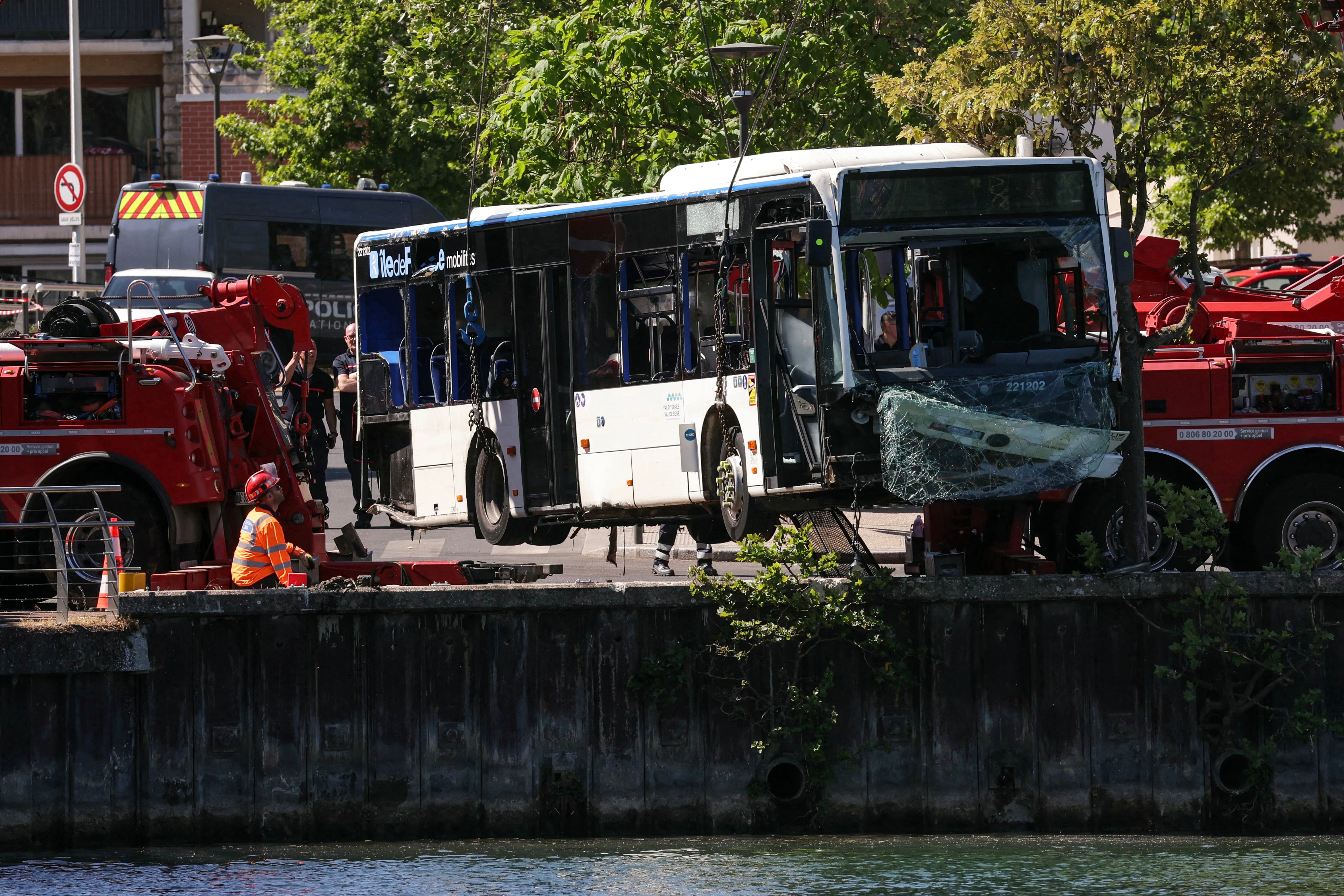 Trainee bus driver crashes into River Seine with passengers on board