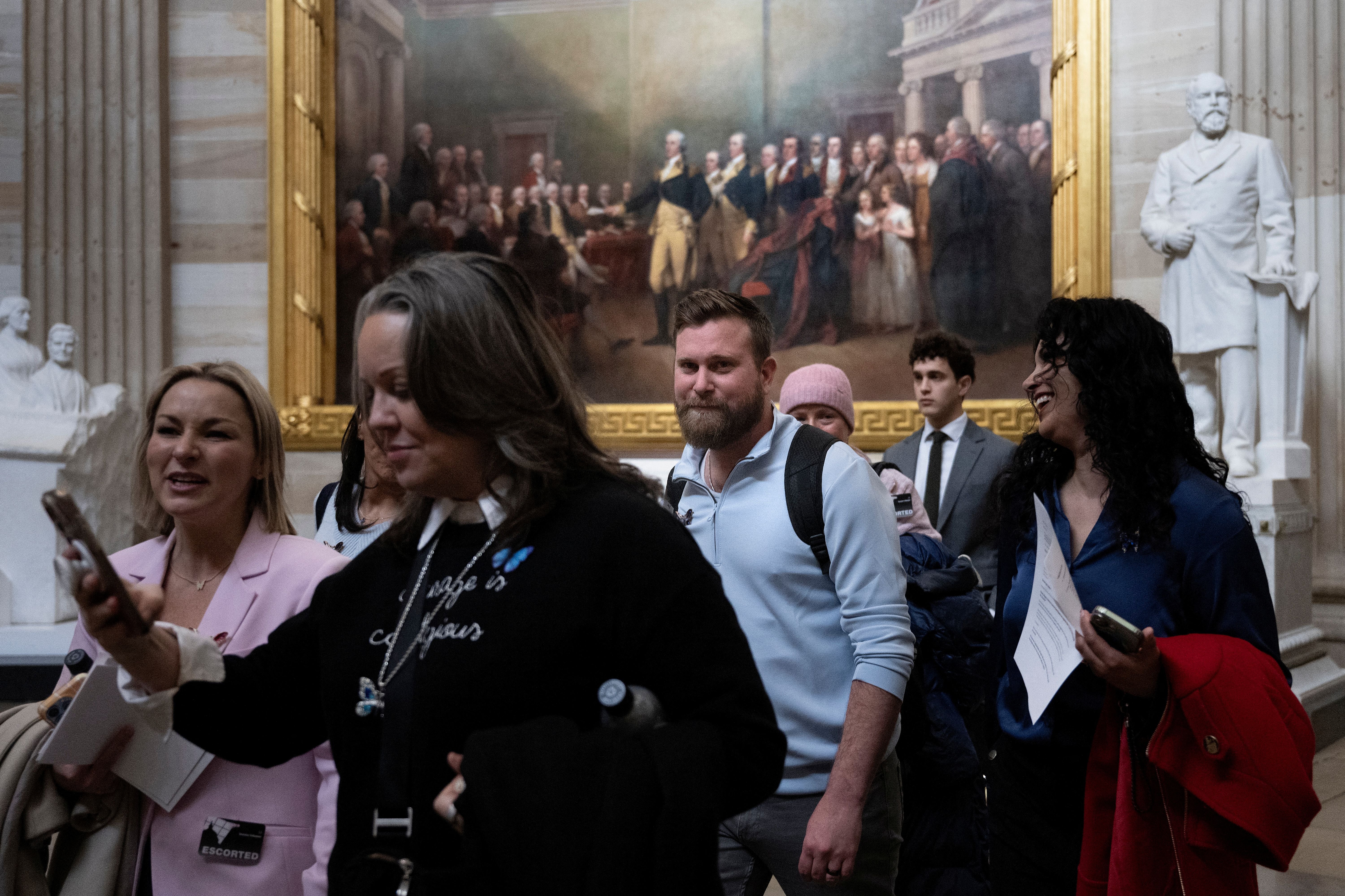 Sky Roberts, brother of the late Jeffrey Epstein victim Virginia Giuffre, walks with other victim advocates through the Capitol on Feb. 10, 2026, in Washington