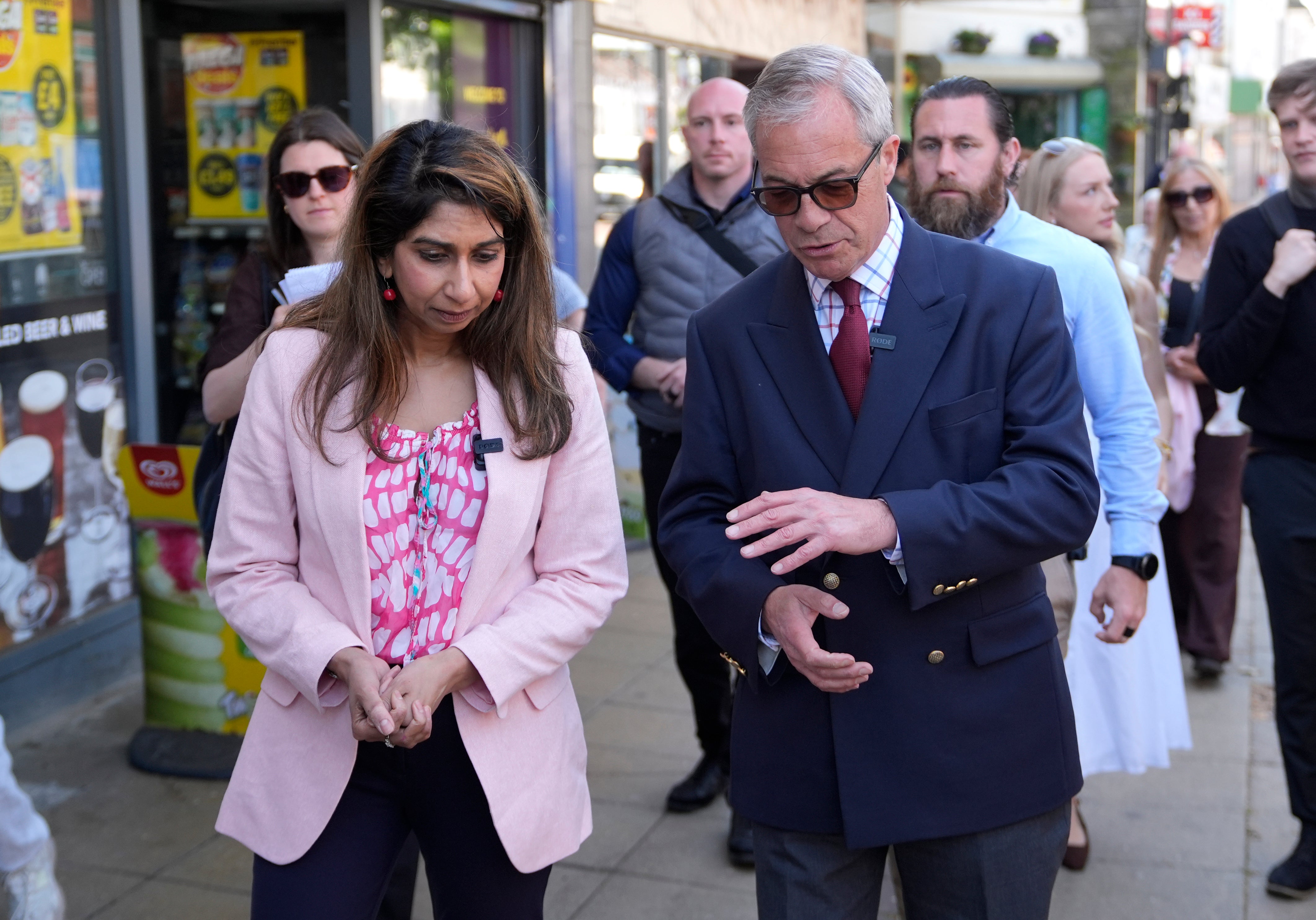 Nigel Farage and Suella Braverman during a walkabout in Waterlooville, Hampshire, whilst on the campaign trail for the upcoming local elections