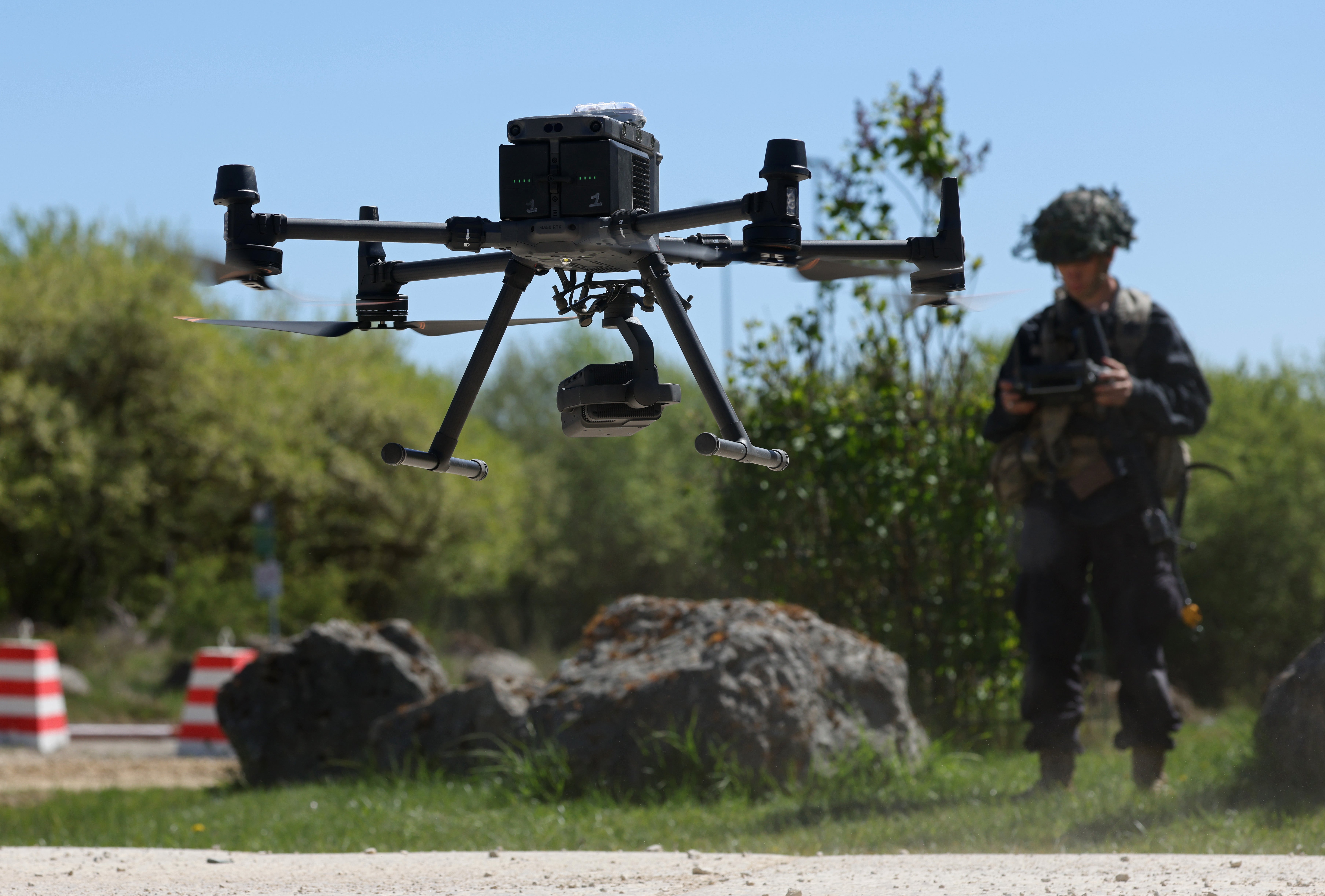 A member of the U.S. Army 7th Army Training Command, clad in black in the role of opposition force, pilots a DJI Matrice drone during the ‘Combined Resolve’ military exercise at the 7th ATC Joint Multinational Readiness Center on April 30, 2026 in Hohenfels, Germany