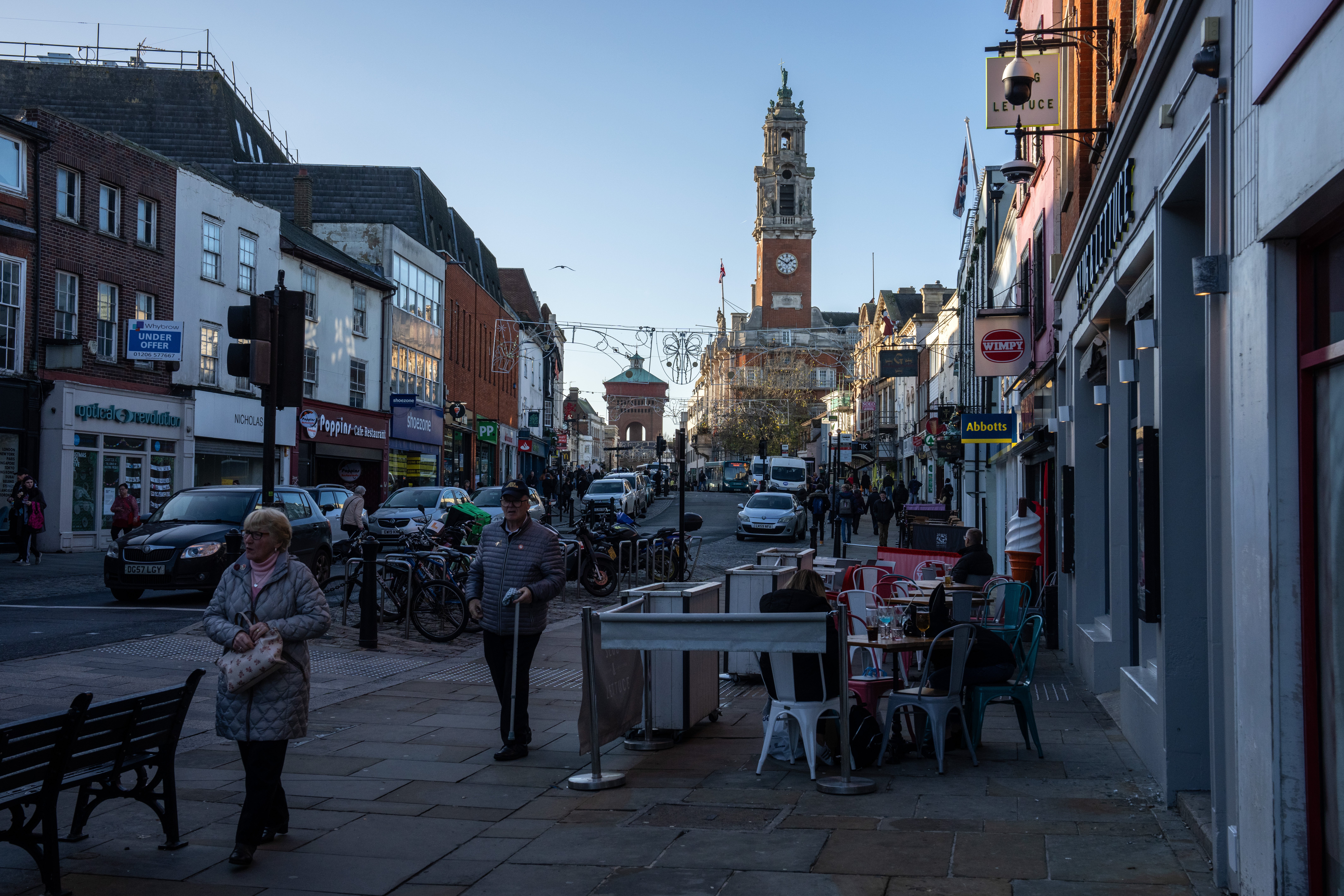 People cross the High Street in Colchester on 25 November 2022