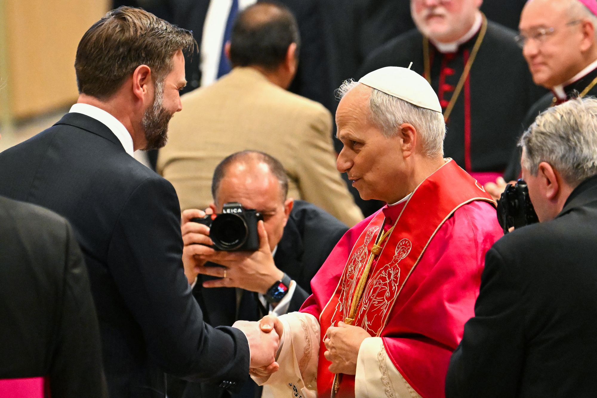 Pope Leo XIV shakes hands with Vice President JD Vance. The vice president has warned the pope should be 'careful when he talks about matters of theology'