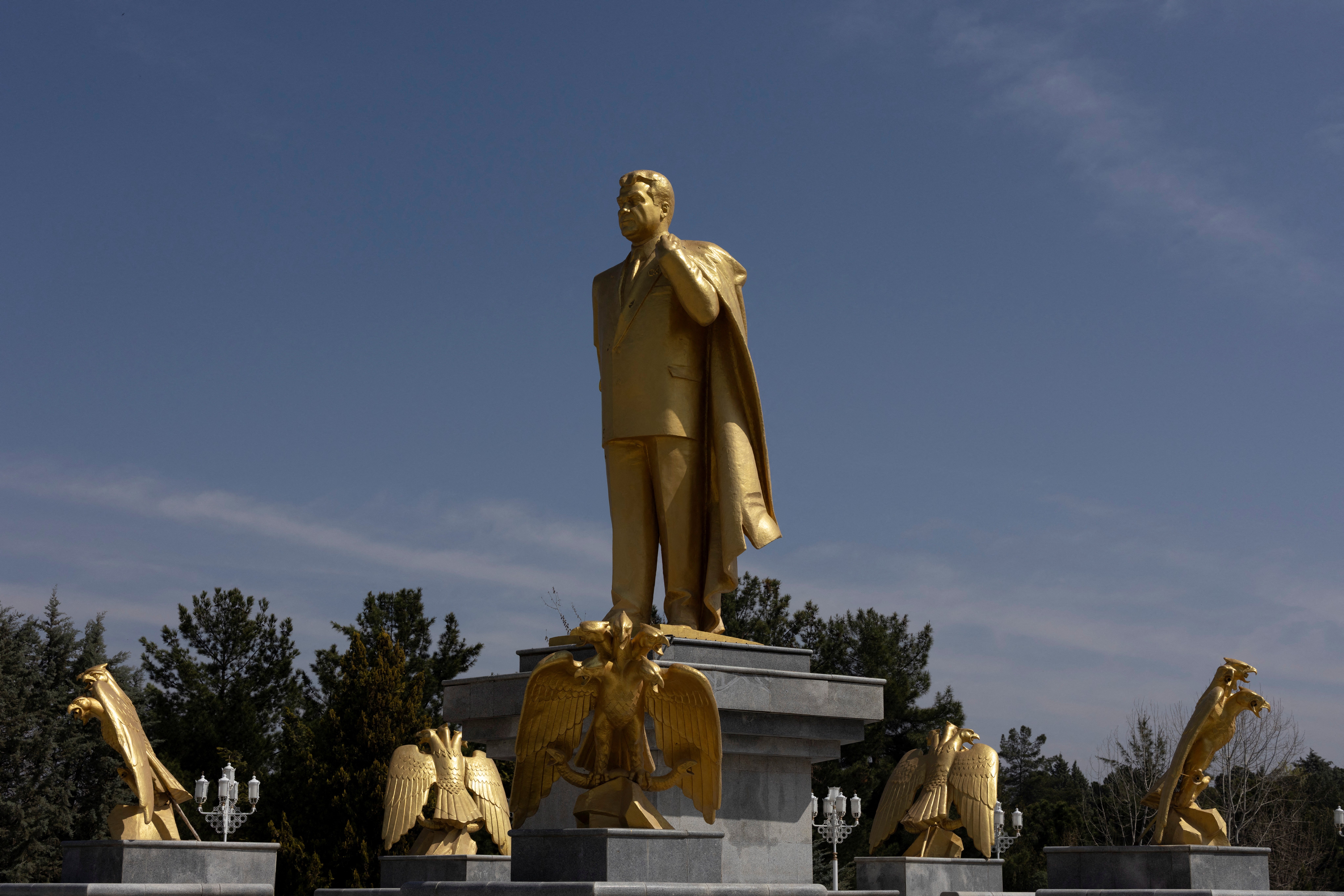 A gold statue of the first and late president of Turkmenistan, Saparmurat Niyazov, at a park in Ashgabat, Turkmenistan