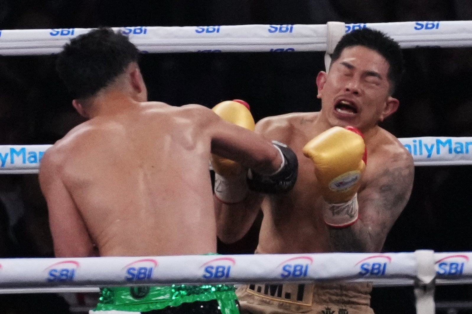 Takuma Inoue lands a clean cross on Kazuto Ioka
