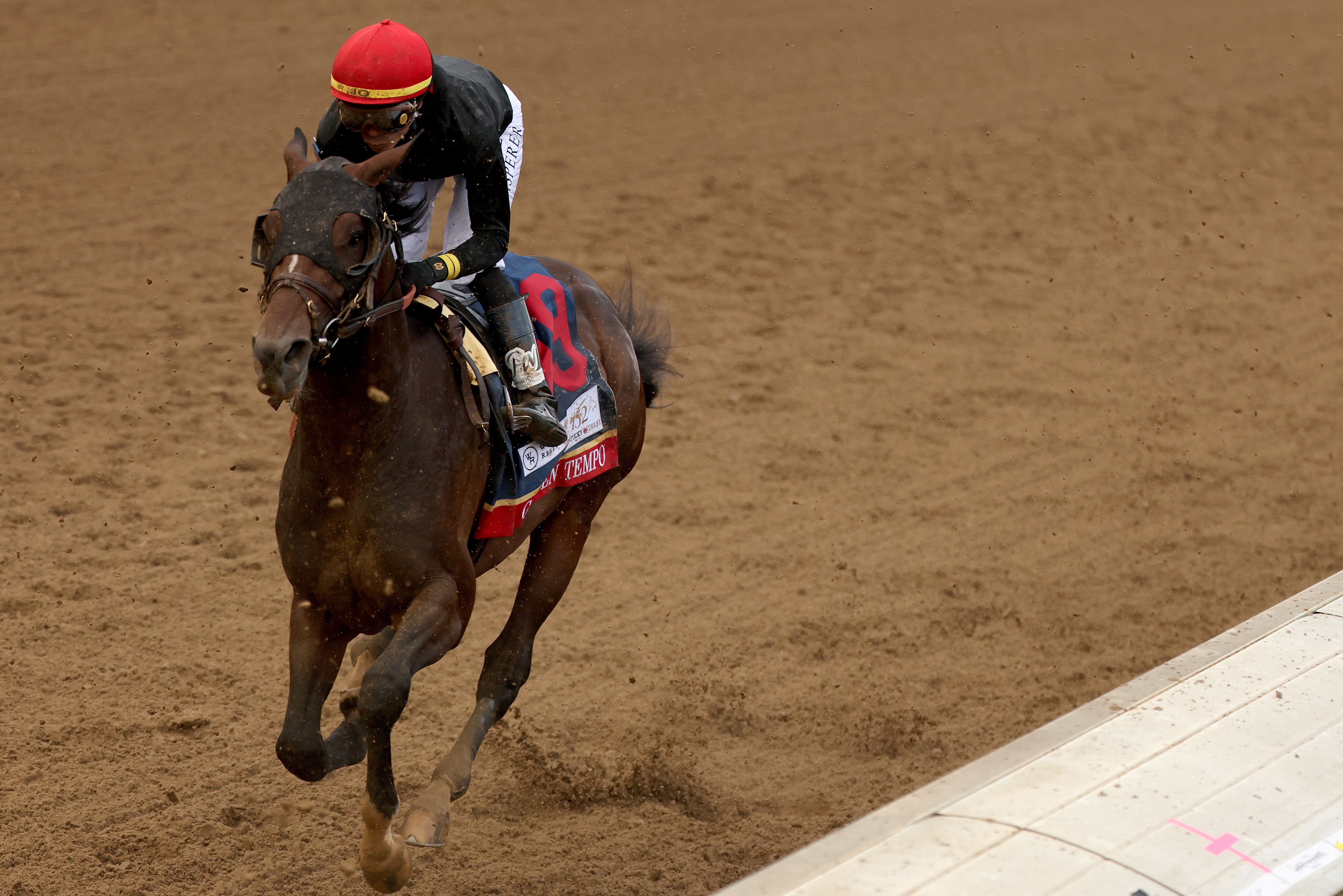 Golden Tempo, ridden by jockey Jose Ortiz, heads into the first turn
