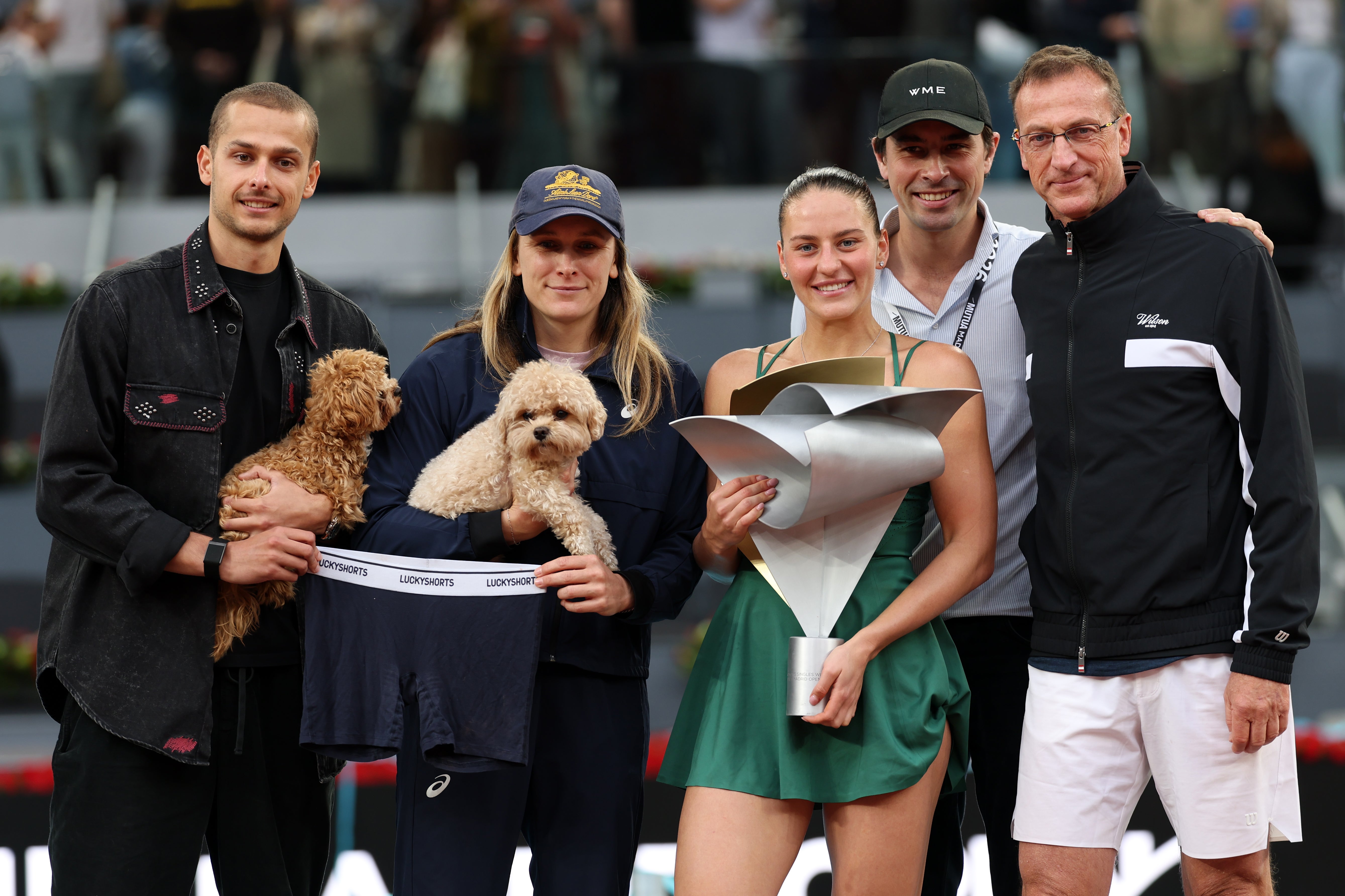 Kostyuk with her team, two dogs and ‘lucky’ underwear