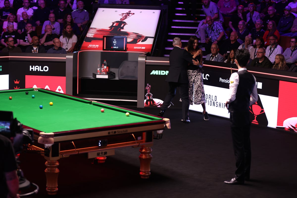 Referee intervening during snooker final protest
