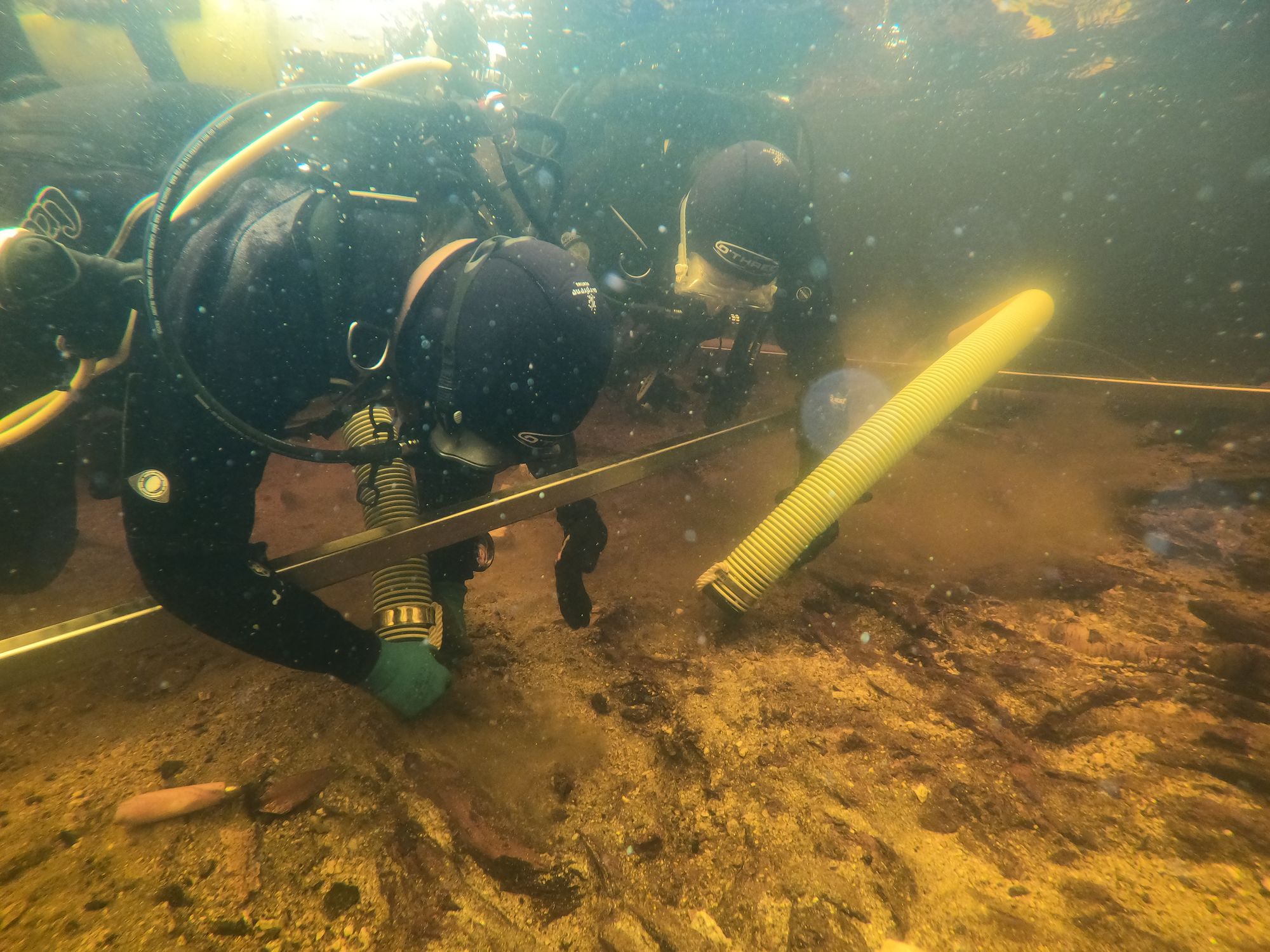 Excavating underwater at Loch Bhorgastail on the Isle of Lewis.