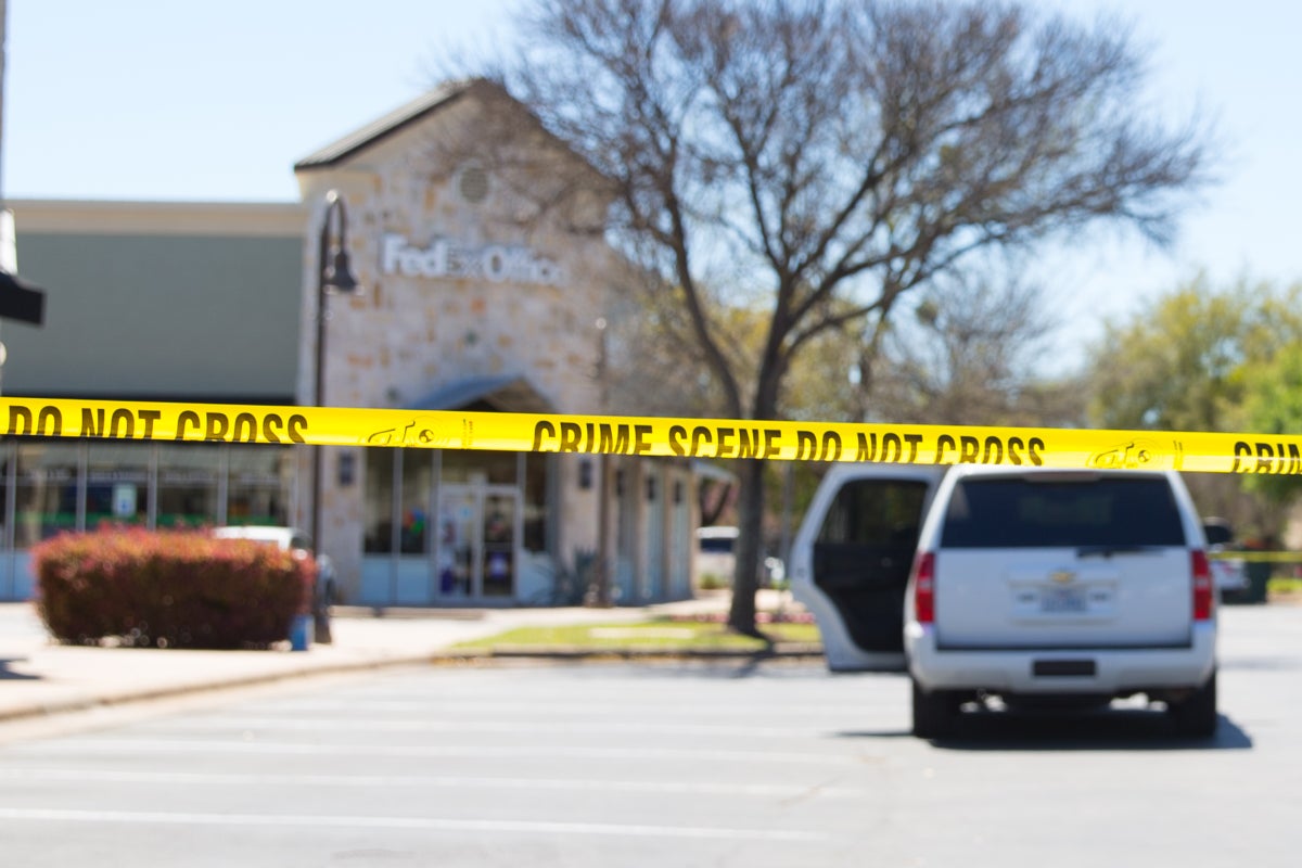 Suspects at large after mass shooting leaves two teens dead and 10 people injured
