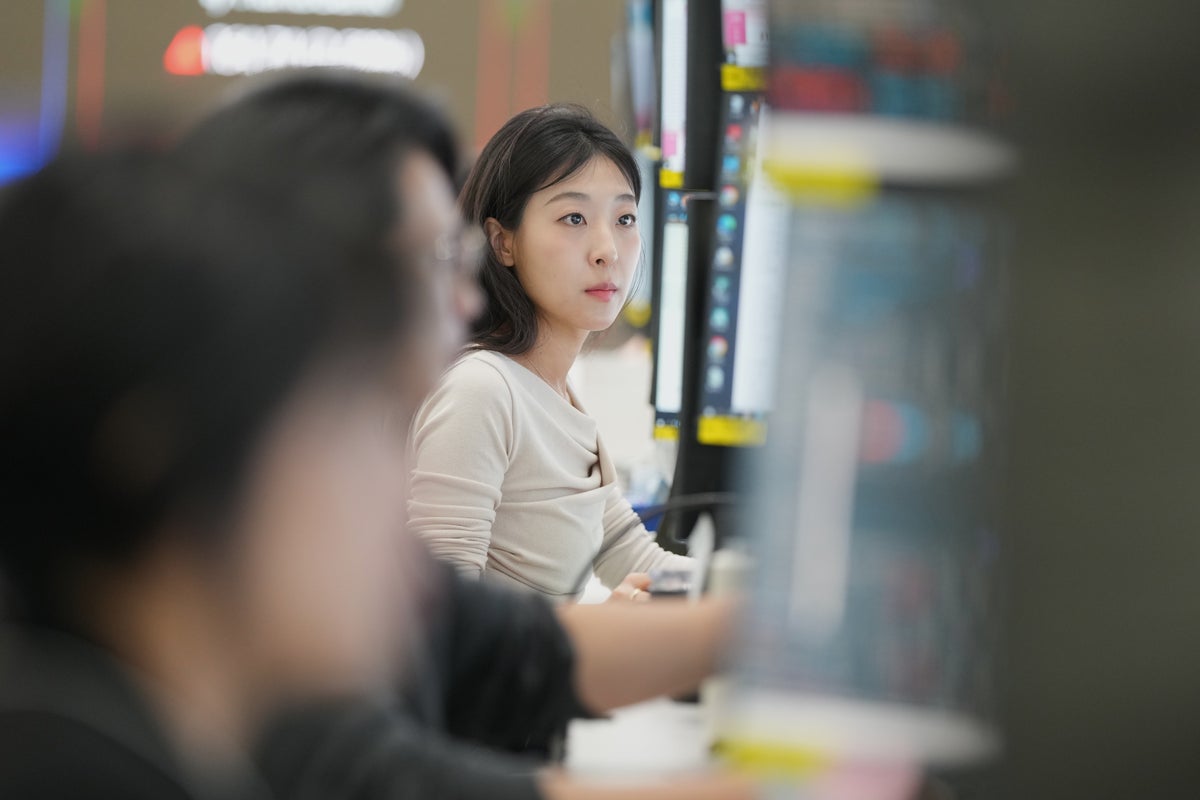 Asian markets are mixed and oil is steady after Wall Street hits records