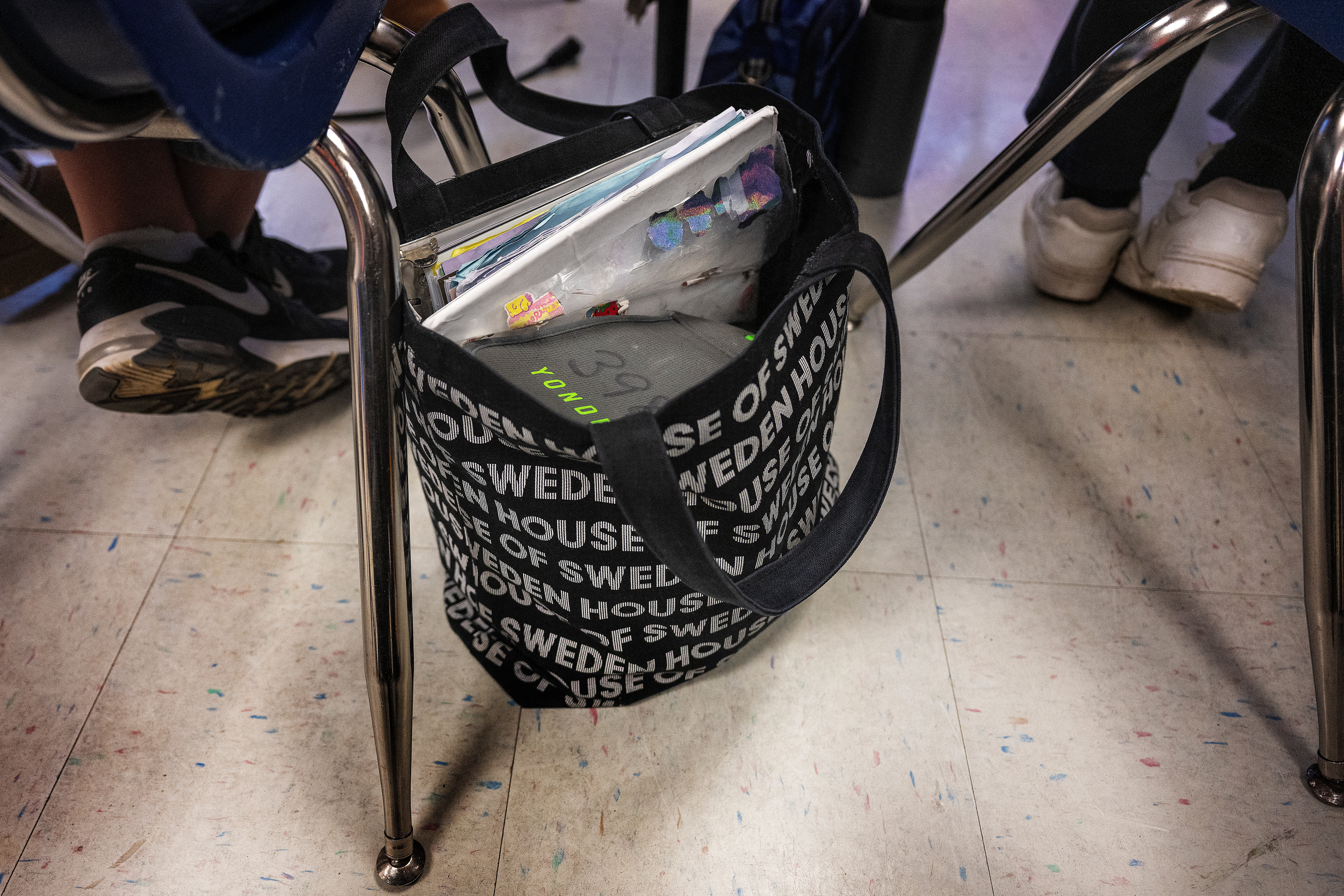A student's bag at Mark Twain Middle School holds the Yondr pouch for their cell phone during class in Alexandria, Virginia, in March 2025. The pouches unlock using a magnetic port
