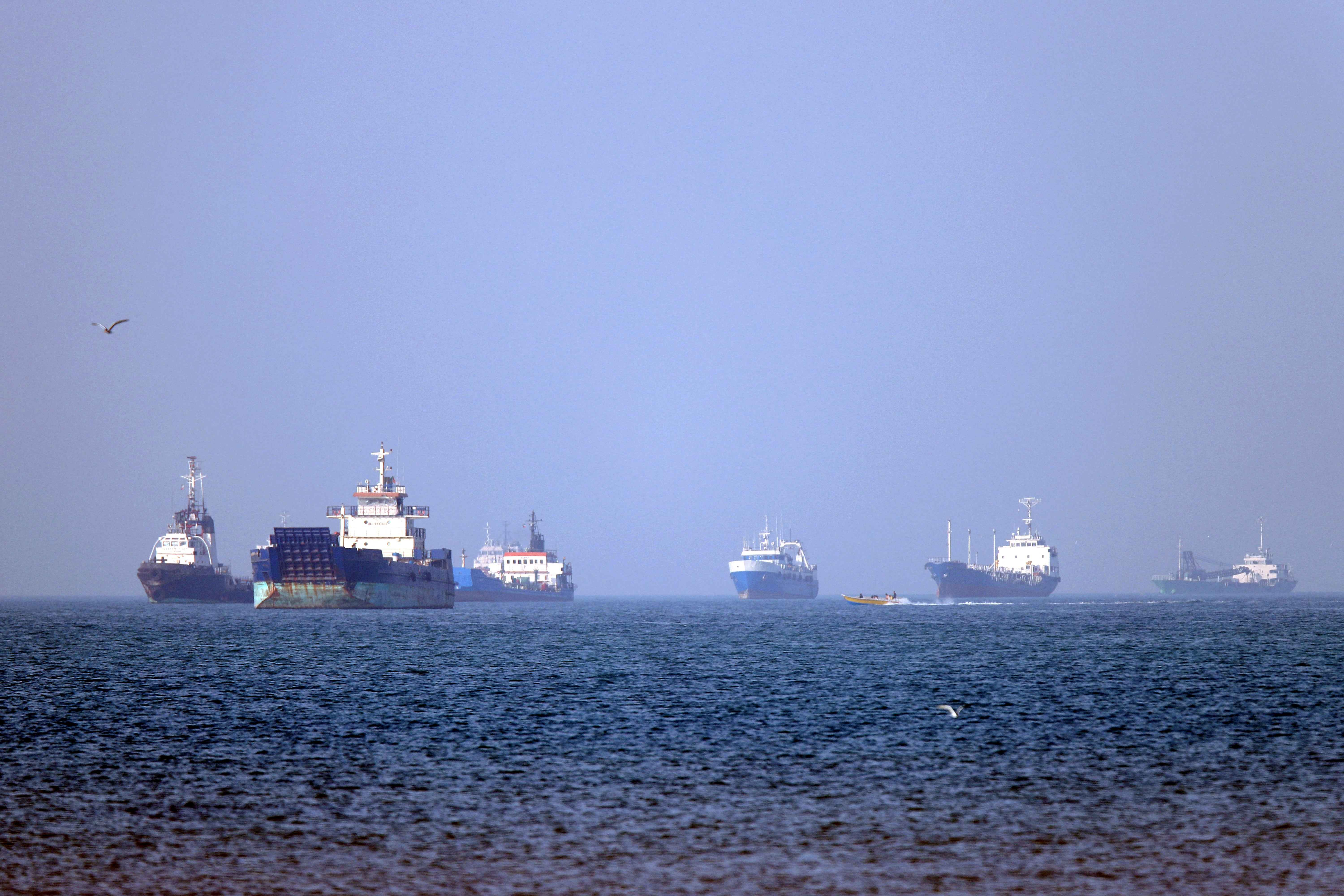 Iran denied that any commercial ships had crossed the Strait of Hormuz after the US military said two US-flagged merchant vessels had transited through the vital waterway