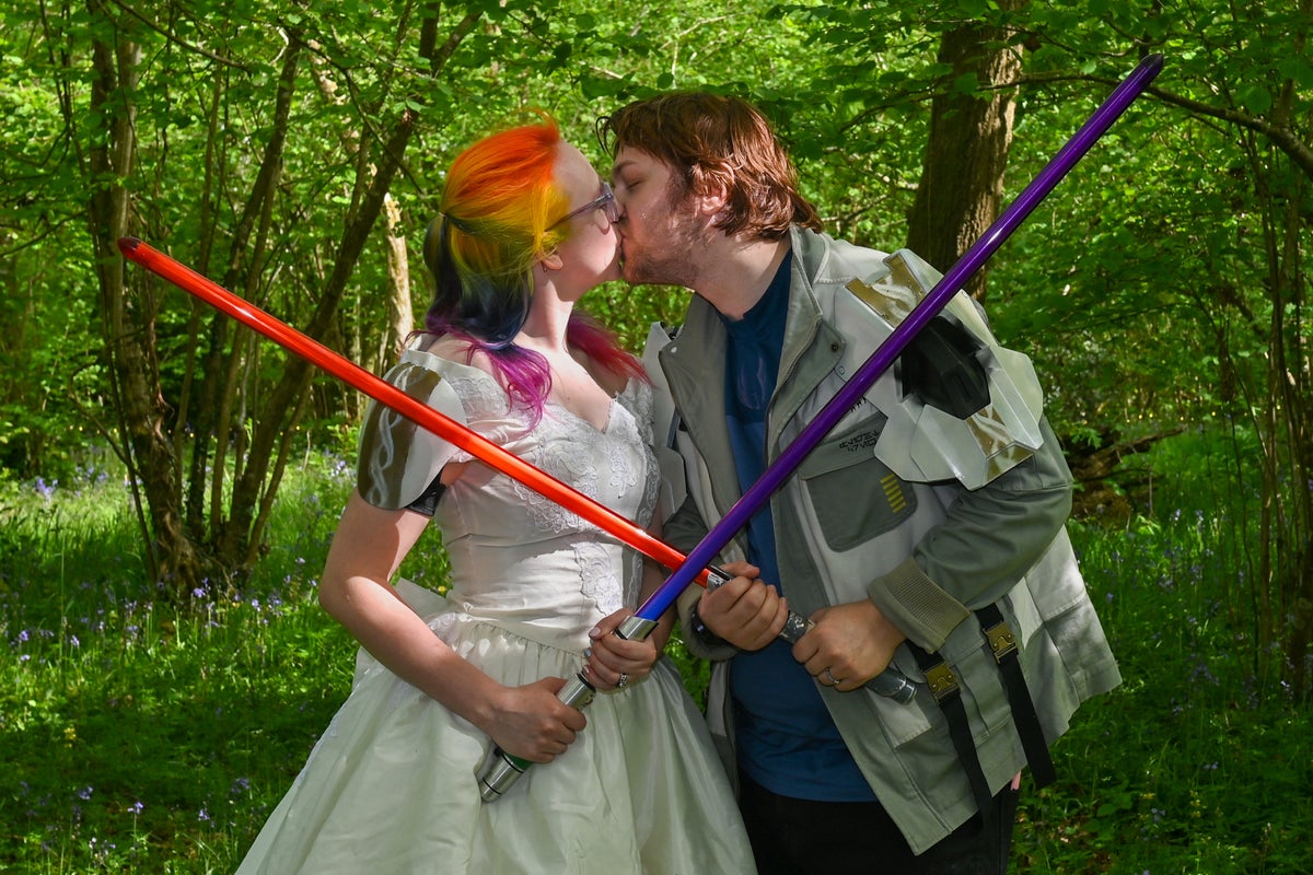 Star Wars fans marry on May the Fourth with lightsabers and droid officiant