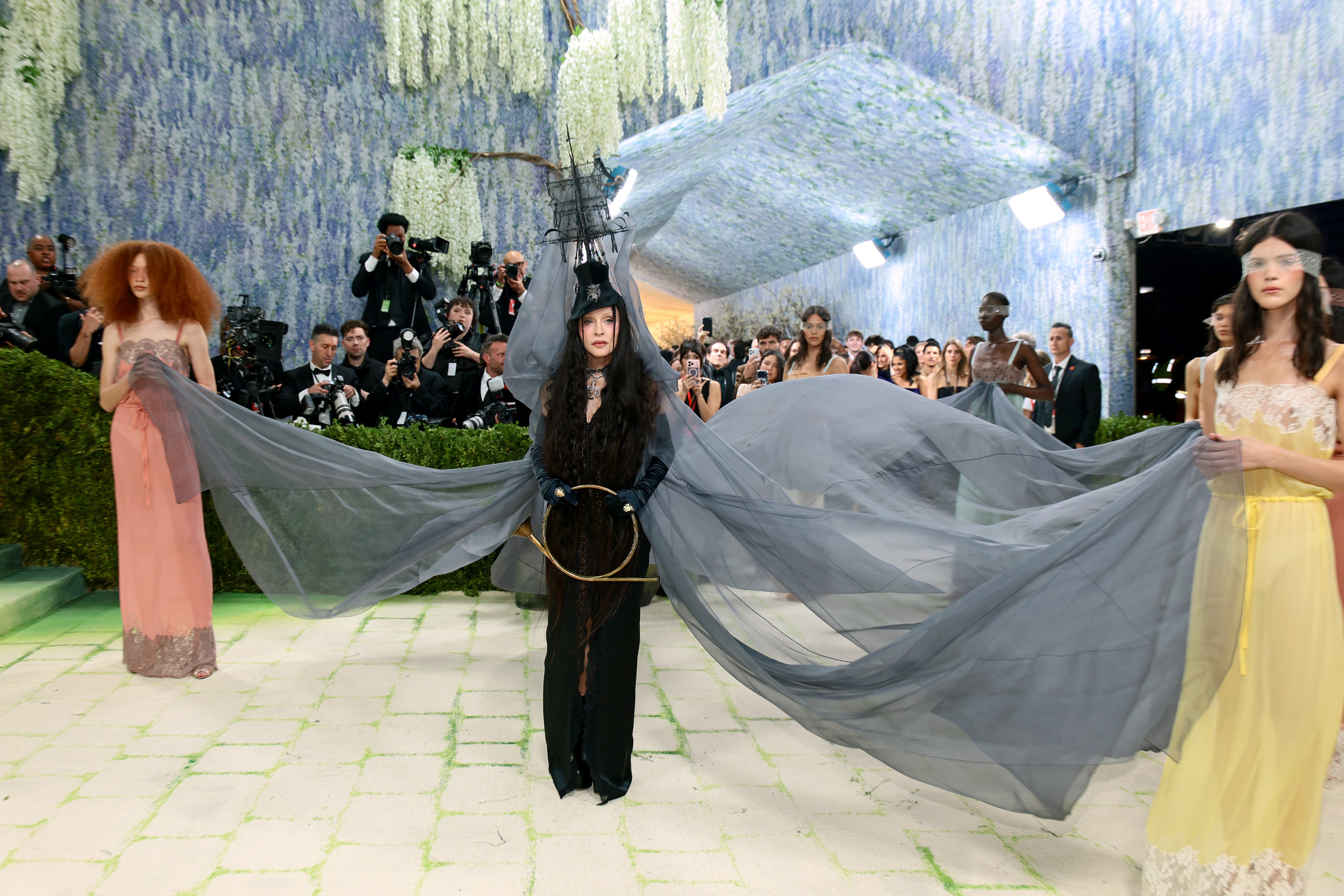 The ‘Vogue’ singer was also joined by several women with sheer blindfolds who help display her outfit