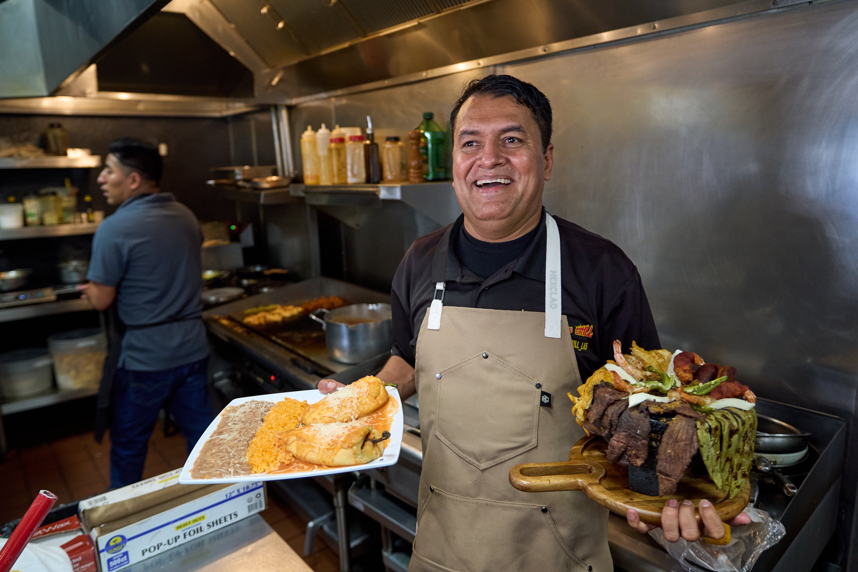 Mexican restaurant owner-chef Marco Mendoza prepares a hot molcajete