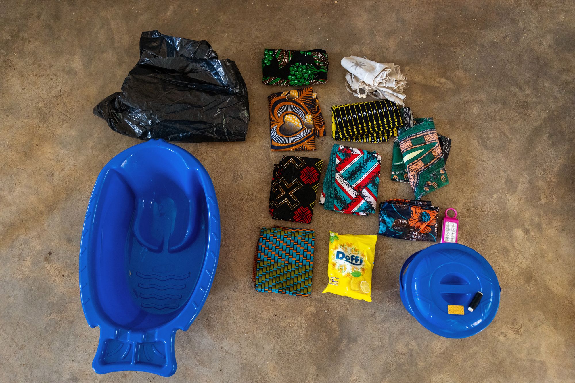 Rose says her maternity bag includes: "A bucket, a baby bath, chitenje cloth, a black sheet of paper, a razor blade and a thread. I also brought a Nyanda [a locally made female diaper], a baby hat. The other clothing and boots she will buy later"