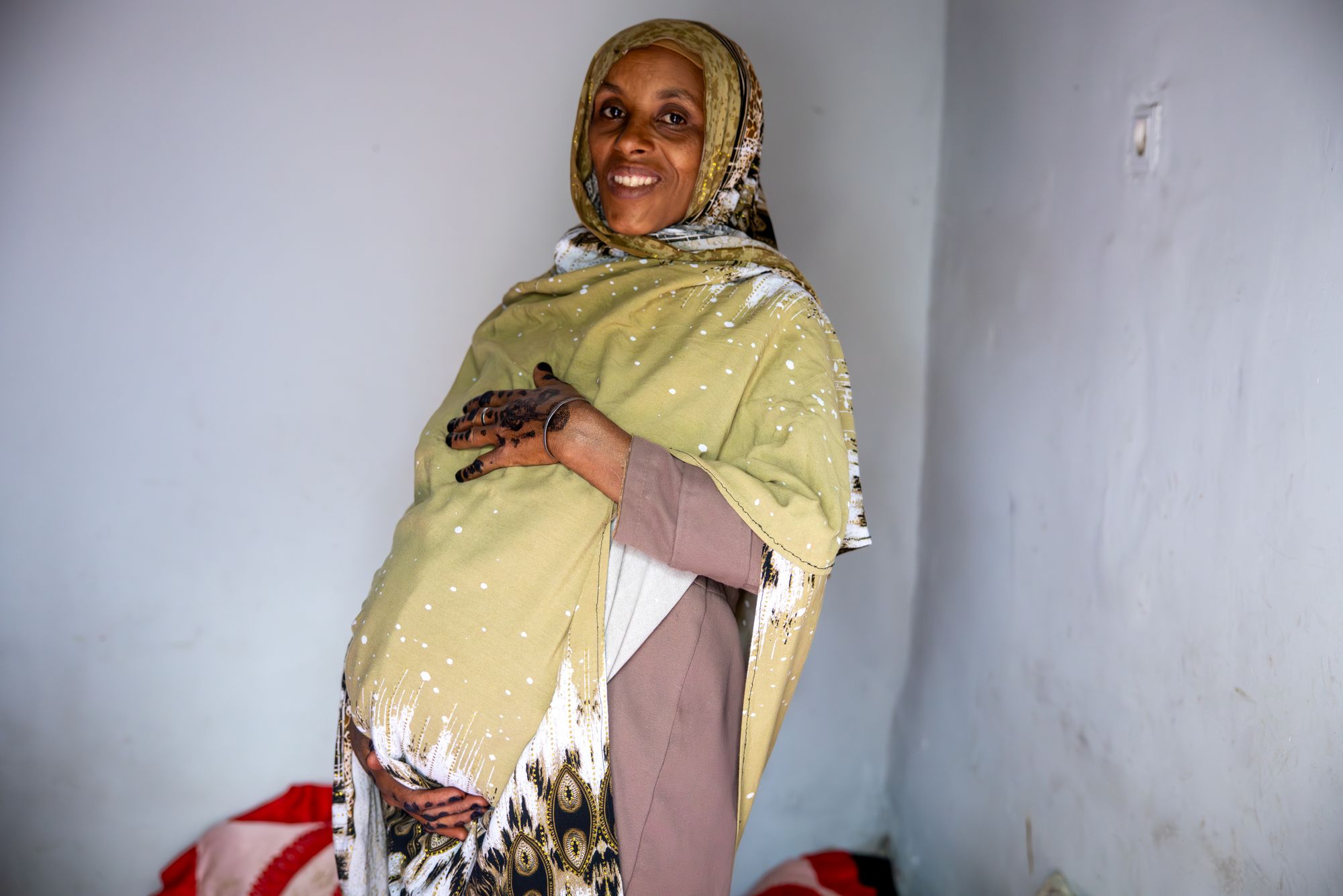Anshiya Haji Huseein, 28, nine months pregnant, standing in her house, Gada Tokuma Kebele, Ethiopia