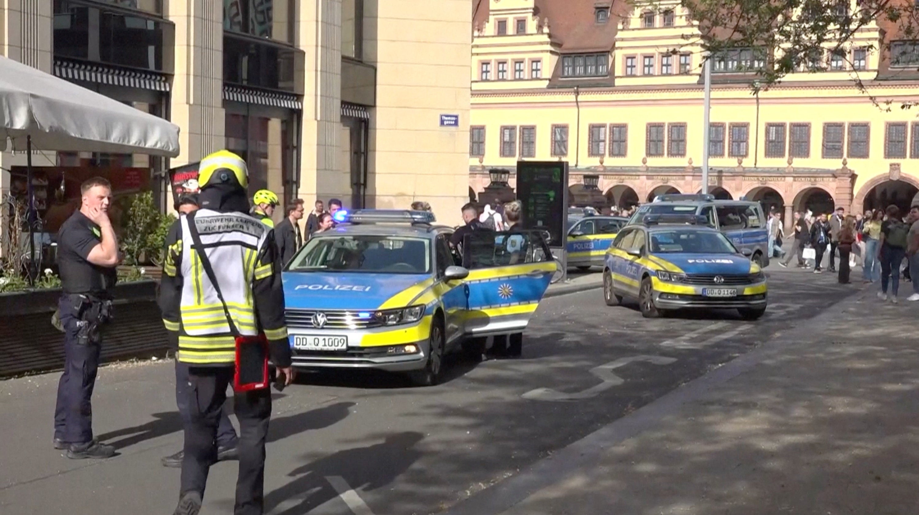 Police officers gather after a car ran into a crowd, in Leipzig, Germany, May 4