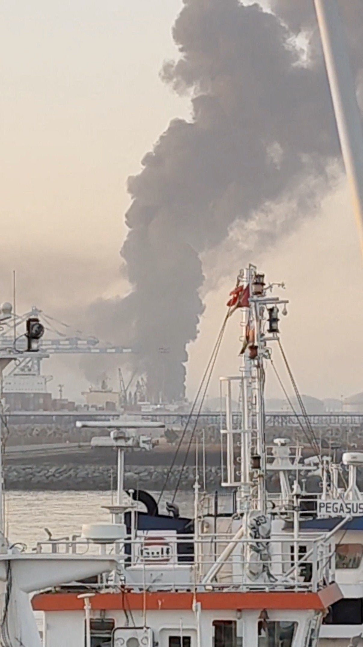 Smoke billows from the Fujairah oil industry zone following a drone attack