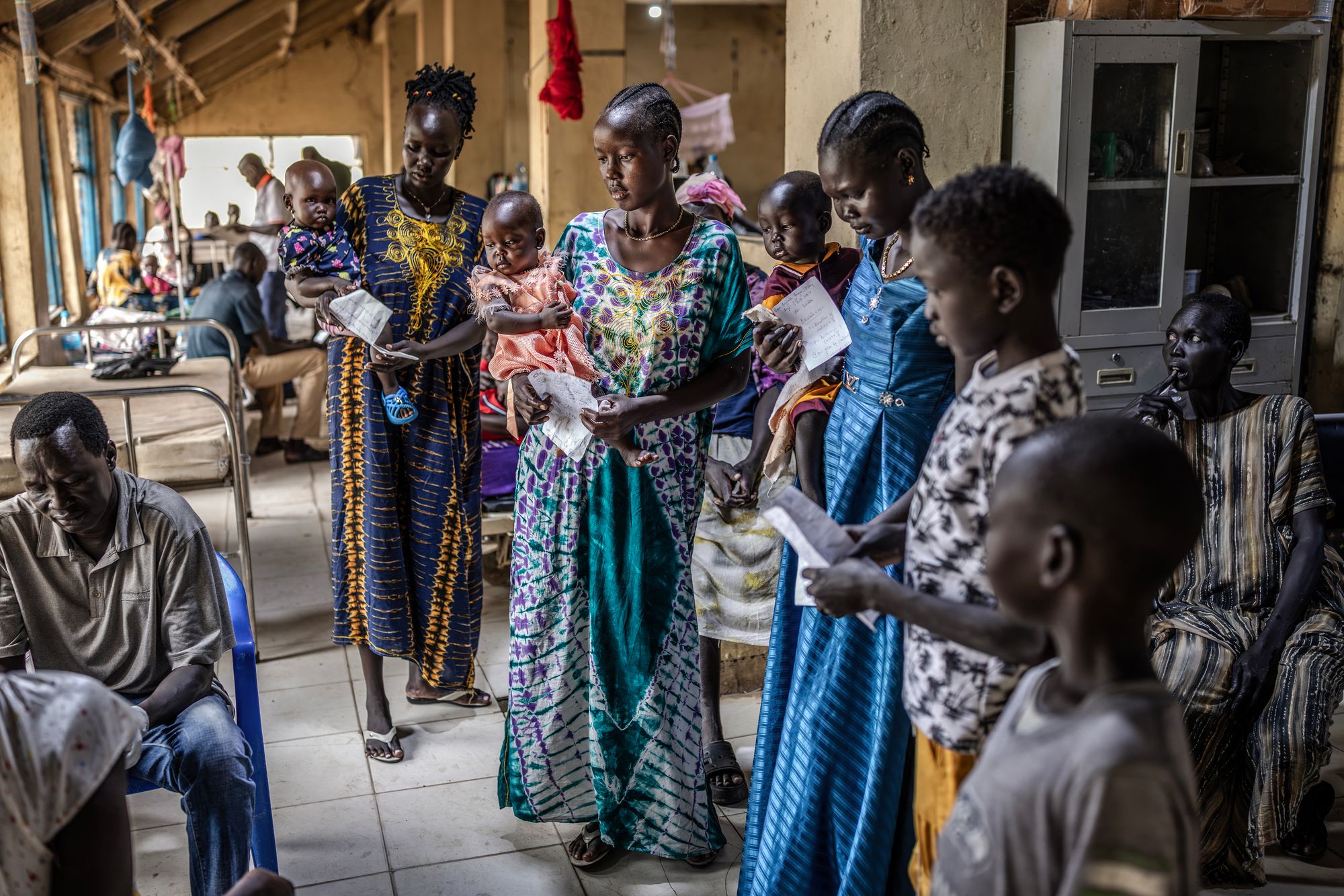 Mothers gather with their babies for medical treatment in South Sudan