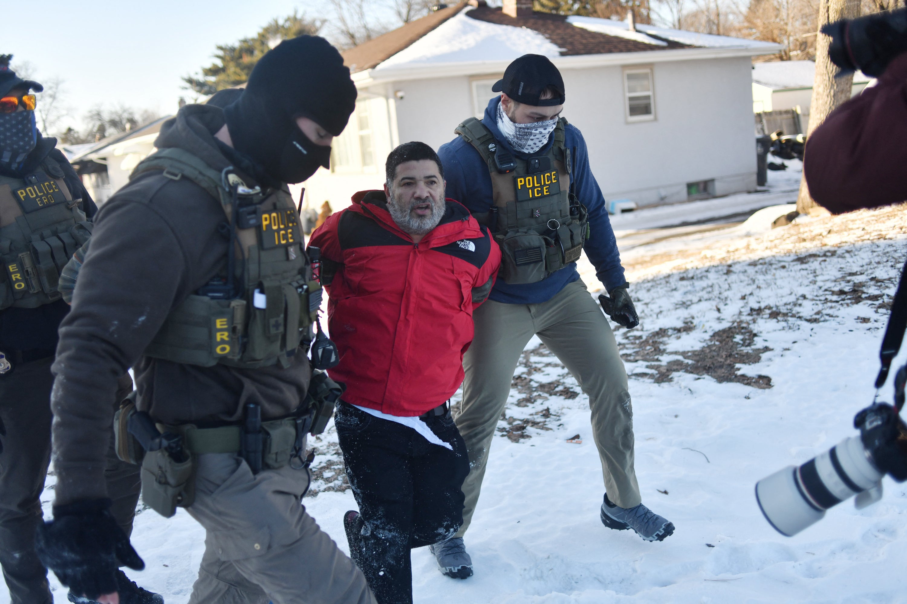 Most Americans think ICE’s actions have gone too far, according to a February poll. Pictured here, federal immigration agents detain a man in St. Paul, Minnesota, on January 27, 2026.