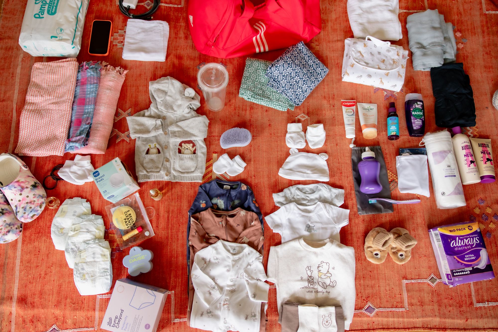 Amira on what her maternity bag contains: "Water bottle, spray bottle, perfume bottle, sanitary towels, shampoo, conditioner, shower gel, hairbrush, nappies, smart phone, toothbrush, toothpaste, cotton wool pads, two nighties my mum brought for me from India, a bracelet that my mum used to wear when I was a kid and I remember thinking it was really, really beautiful. Baby clothes, we washed and ironed them because we want them to really experience a nice first few moments on earth"