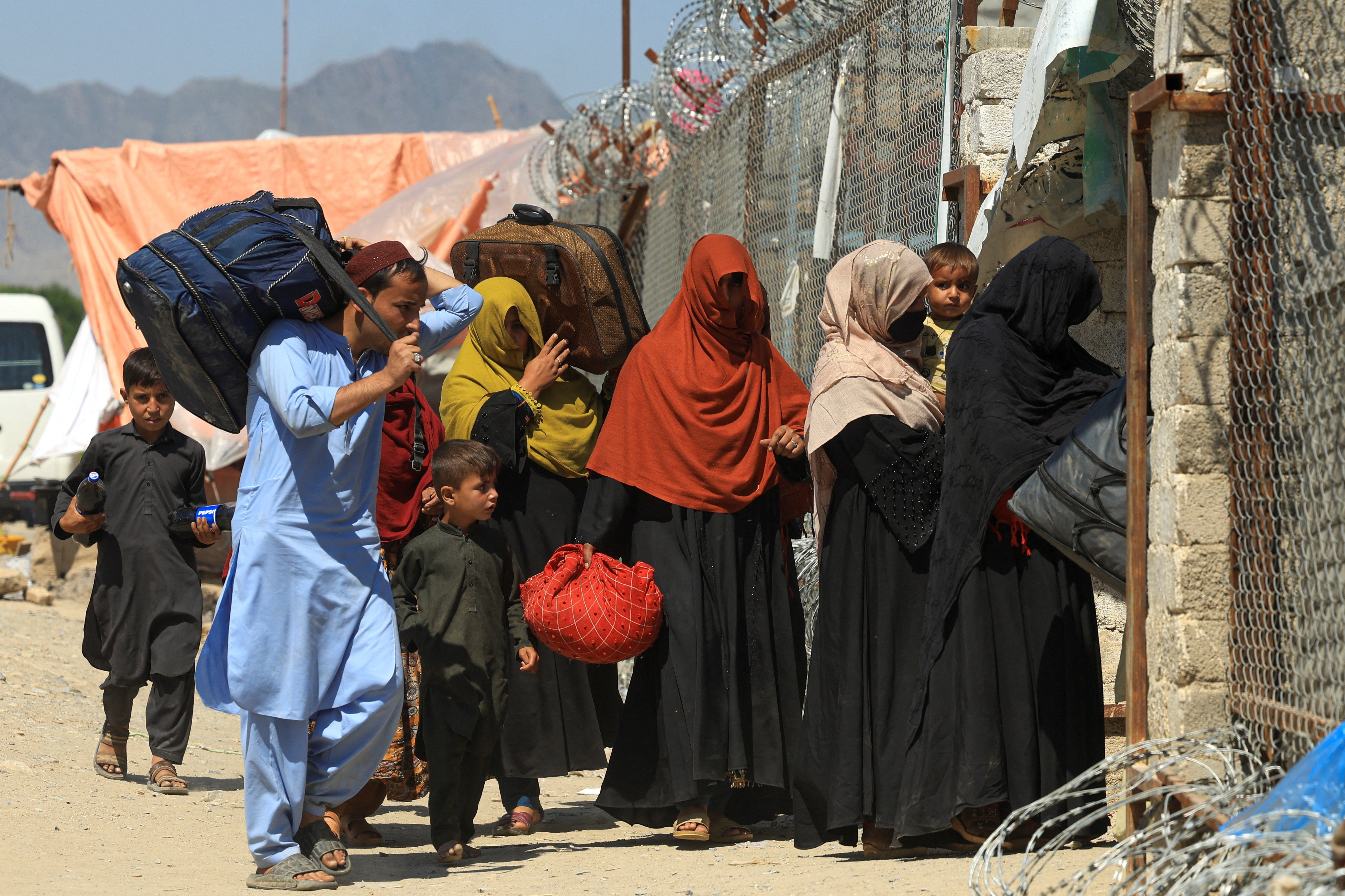 Afghan women walk on the outskirts of Kabul