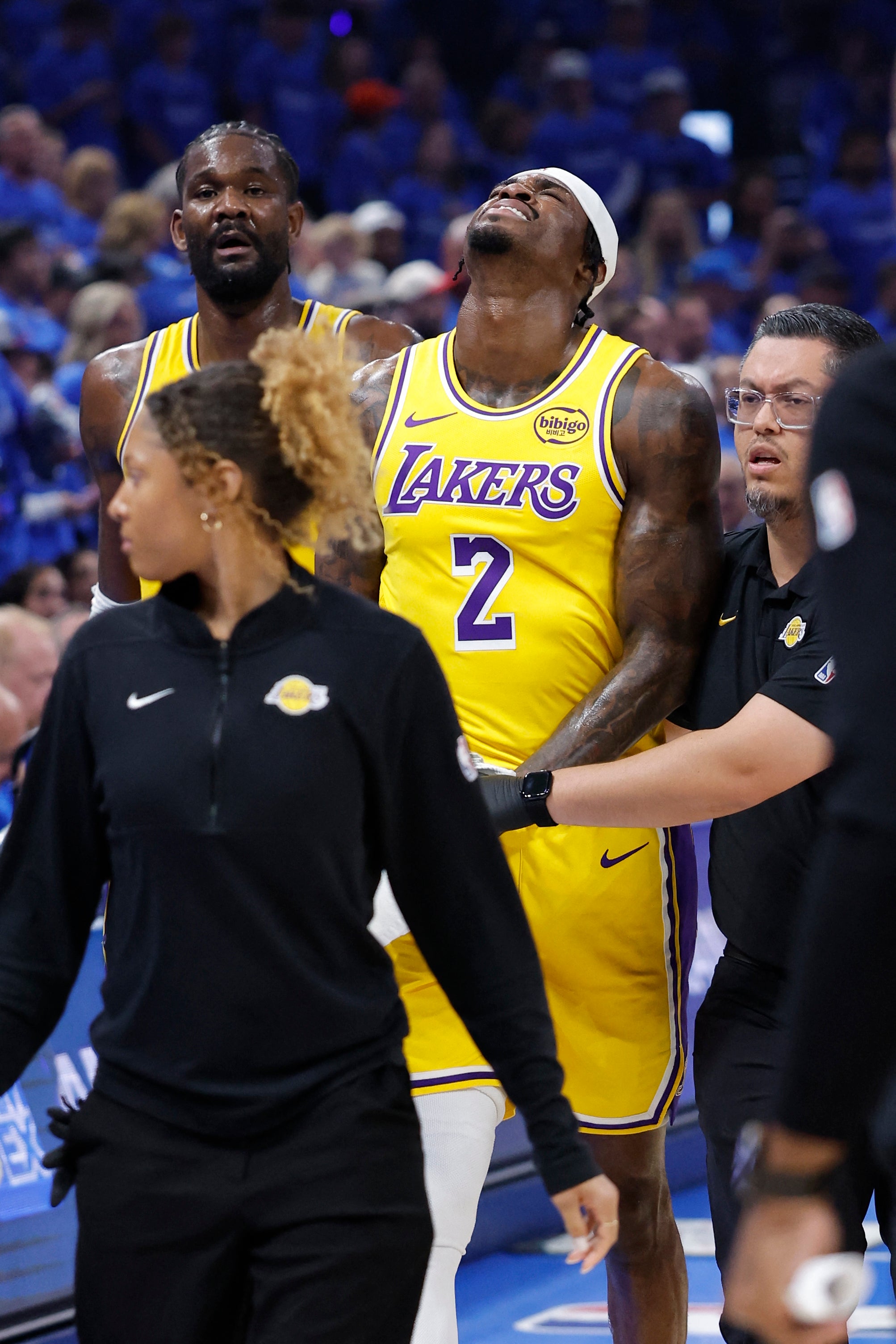 Jarred Vanderbilt (2) walks off the court and to the locker room in pain after a play against the Oklahoma City Thunder