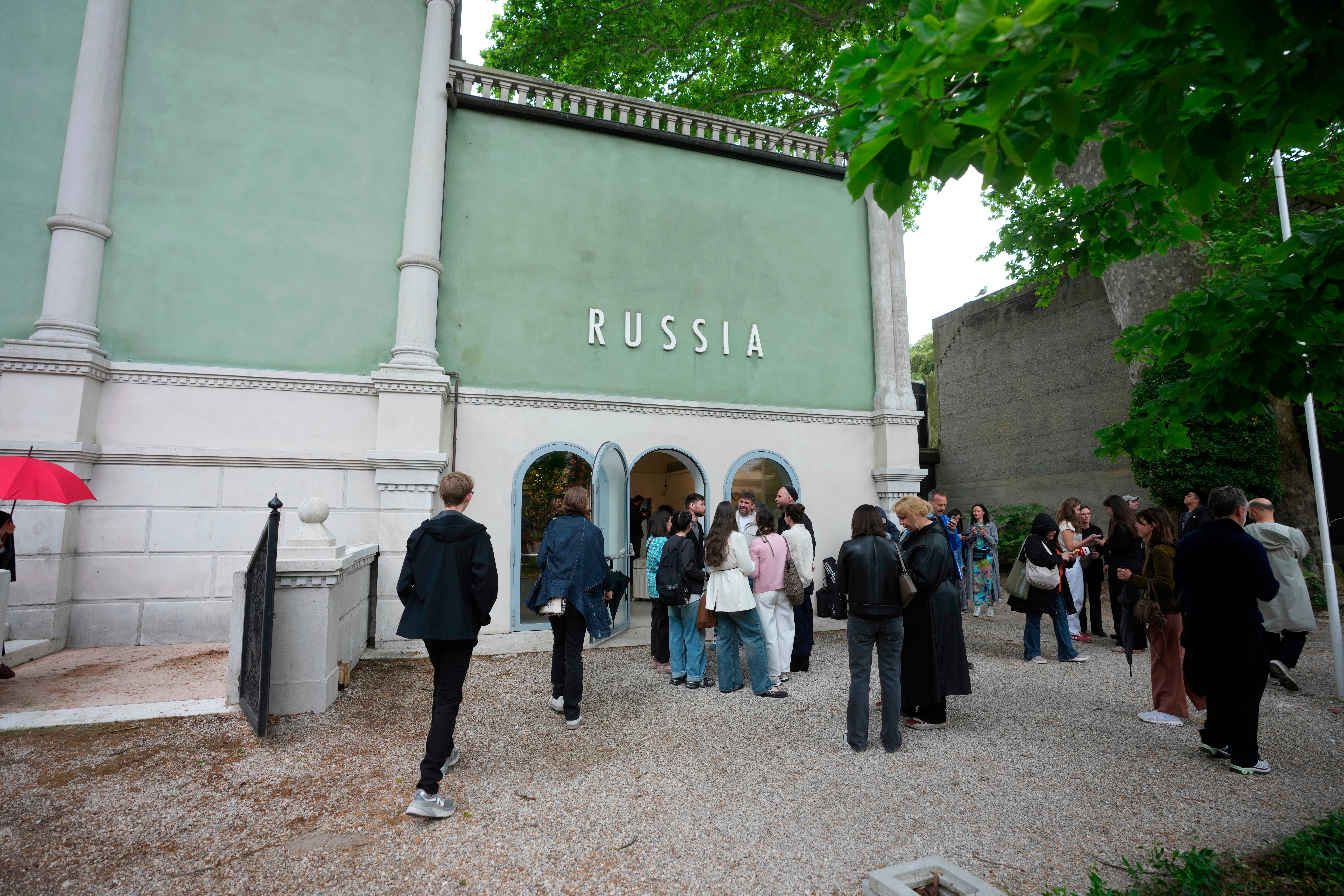 Visitors stand outside the Russia pavilion.