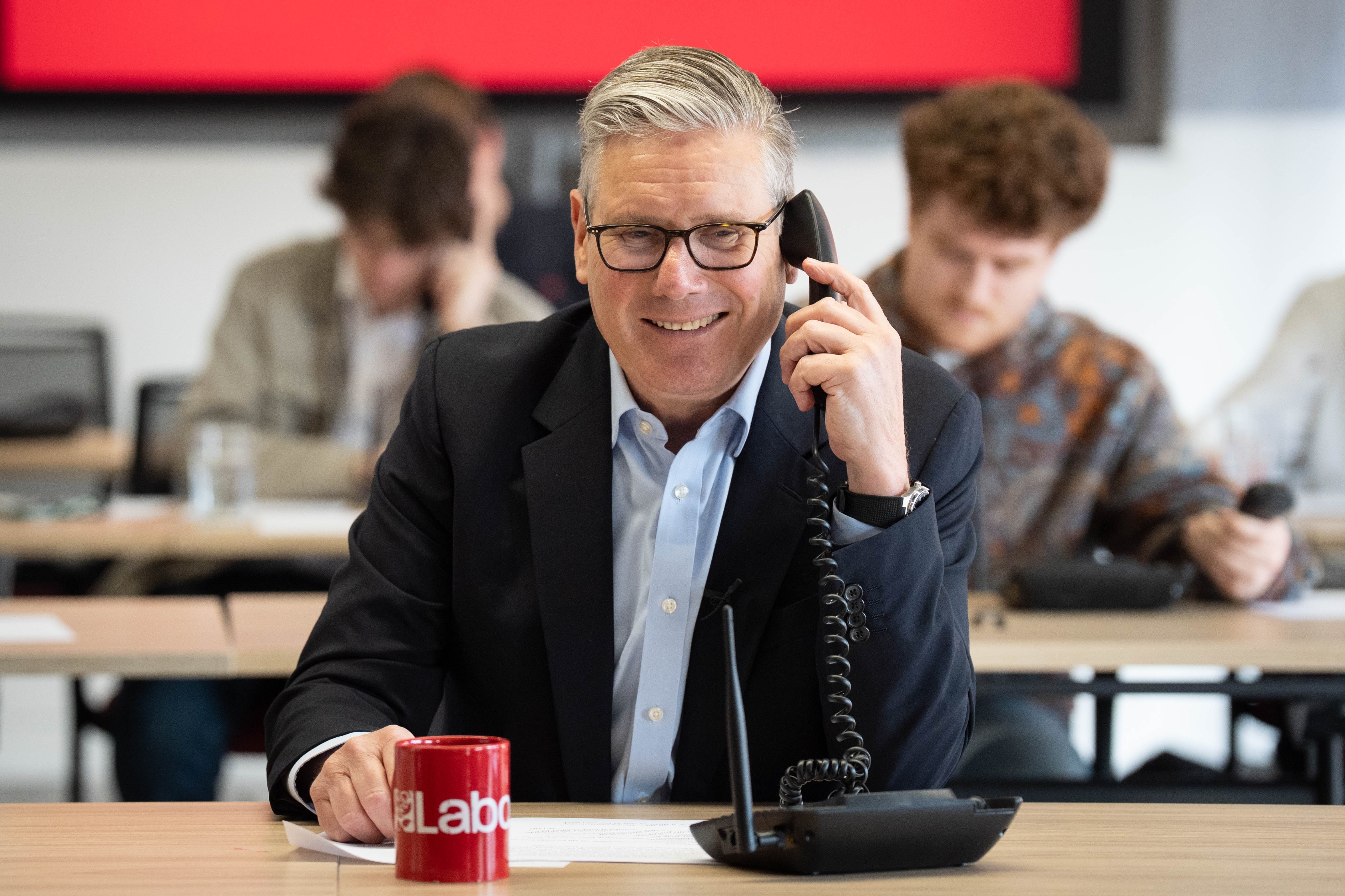 Starmer helps out in the call centre at Labour Party headquarters in London on Wednesday, the last day of campaigning