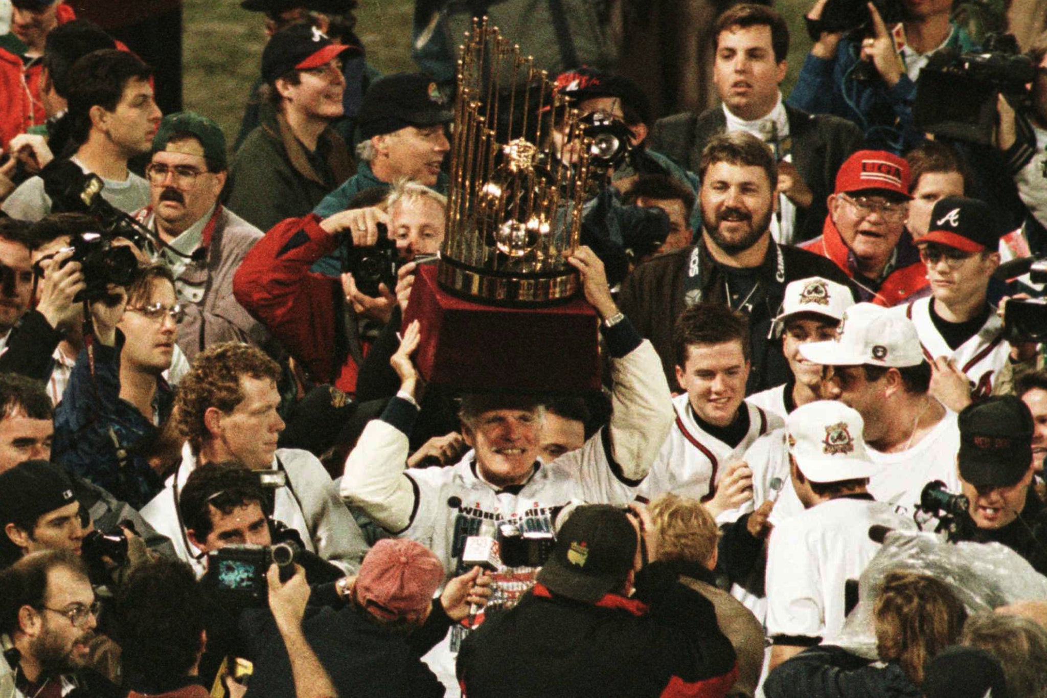 Ted Turner holding up the 1995 World Series trophy after the Atlanta Braves won