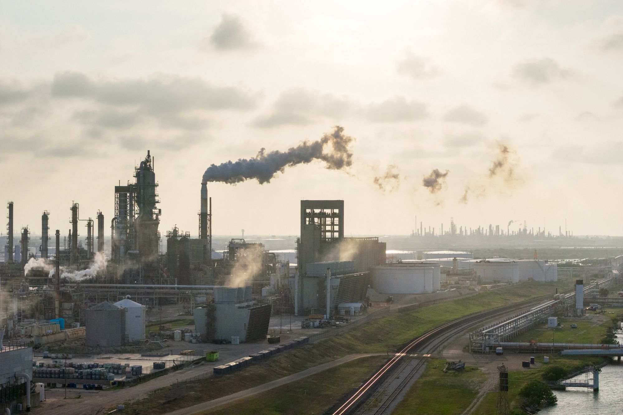 Barring US companies from exporting oil abroad would come with a series of risks, including throwing the global economy into a recession. Pictured here is an oil refinery in Corpus Christi, Texas
