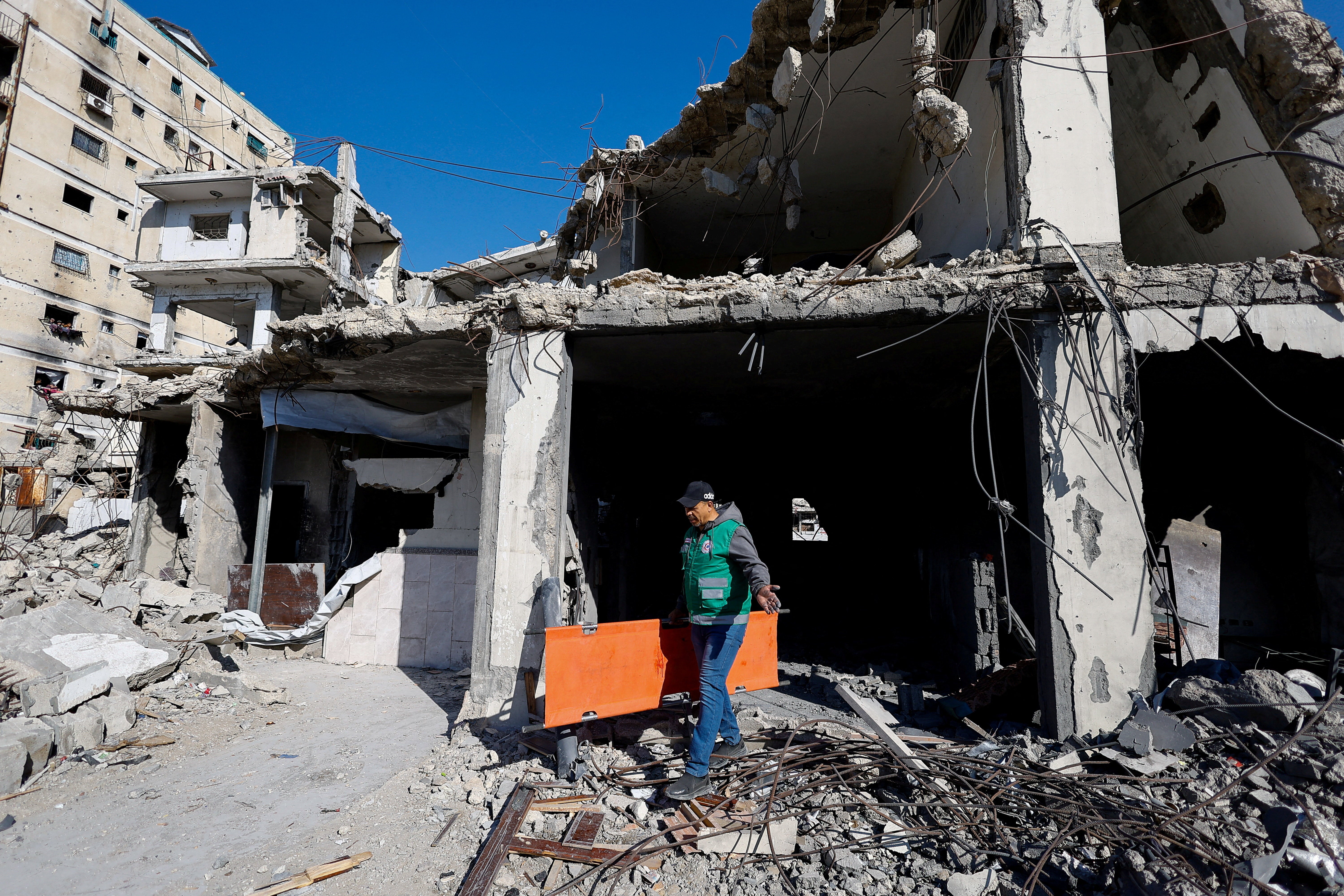 A Palestinian man inspects the site of an Israeli strike that targeted a police post, in Gaza City, May 5, 2026