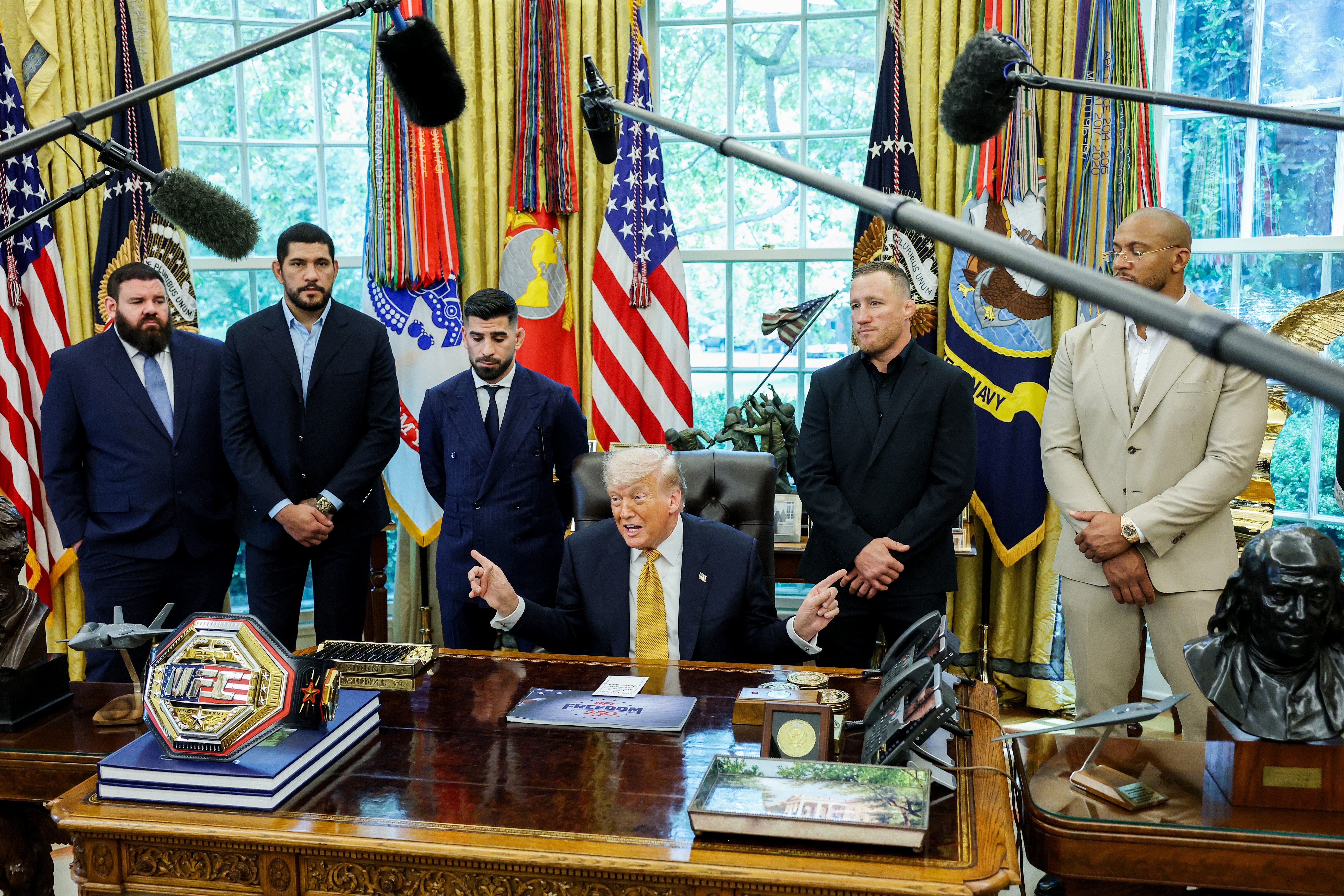 Trump turned to UFC fighter Justin Gaethje (second from right) for his opinion on the U.S. war against Iran on Wednesday