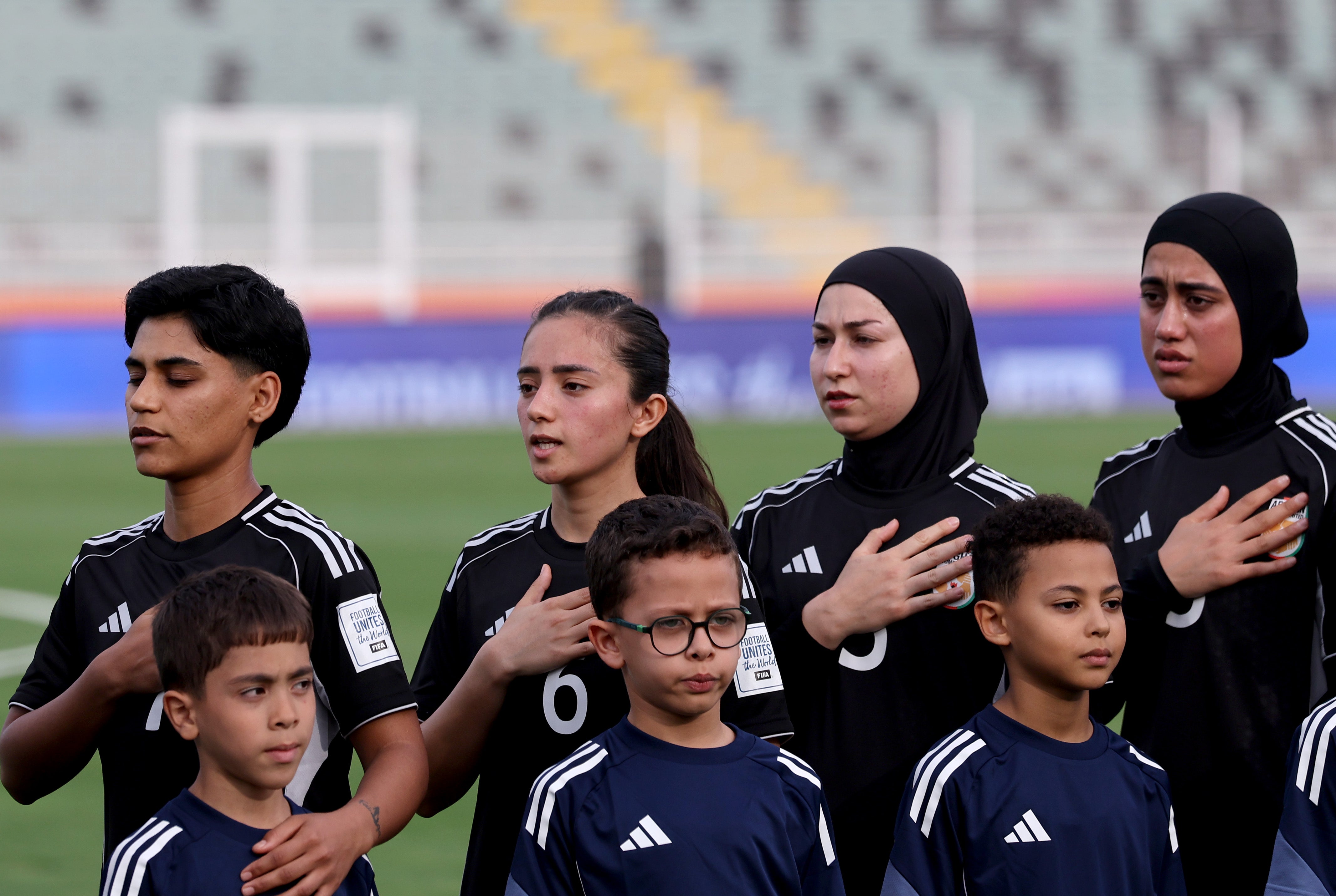 Afghan Women United players sing the national anthem before a match against Chad at Stade Municipal de Berrechid on 26 October 2025