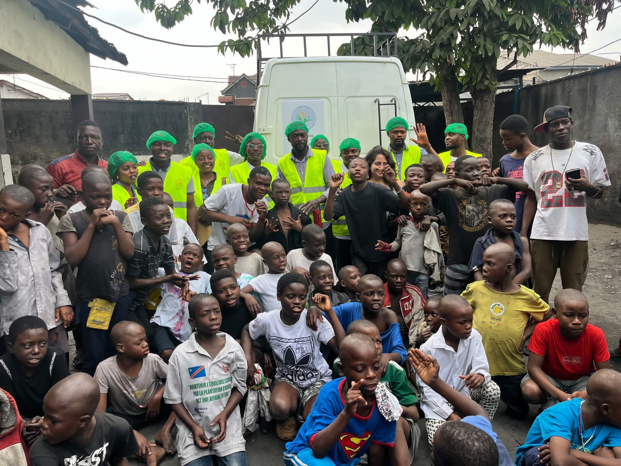 Workers and users of Mapendo Banque Alimentaire in Kinshasa gather for a photograph