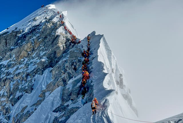 <p>Mountaineers form a queue as they approach the summit of Mount Everest in Nepal, May 18, 2025. (AP Photo/Kunga Sherpa, File)</p>