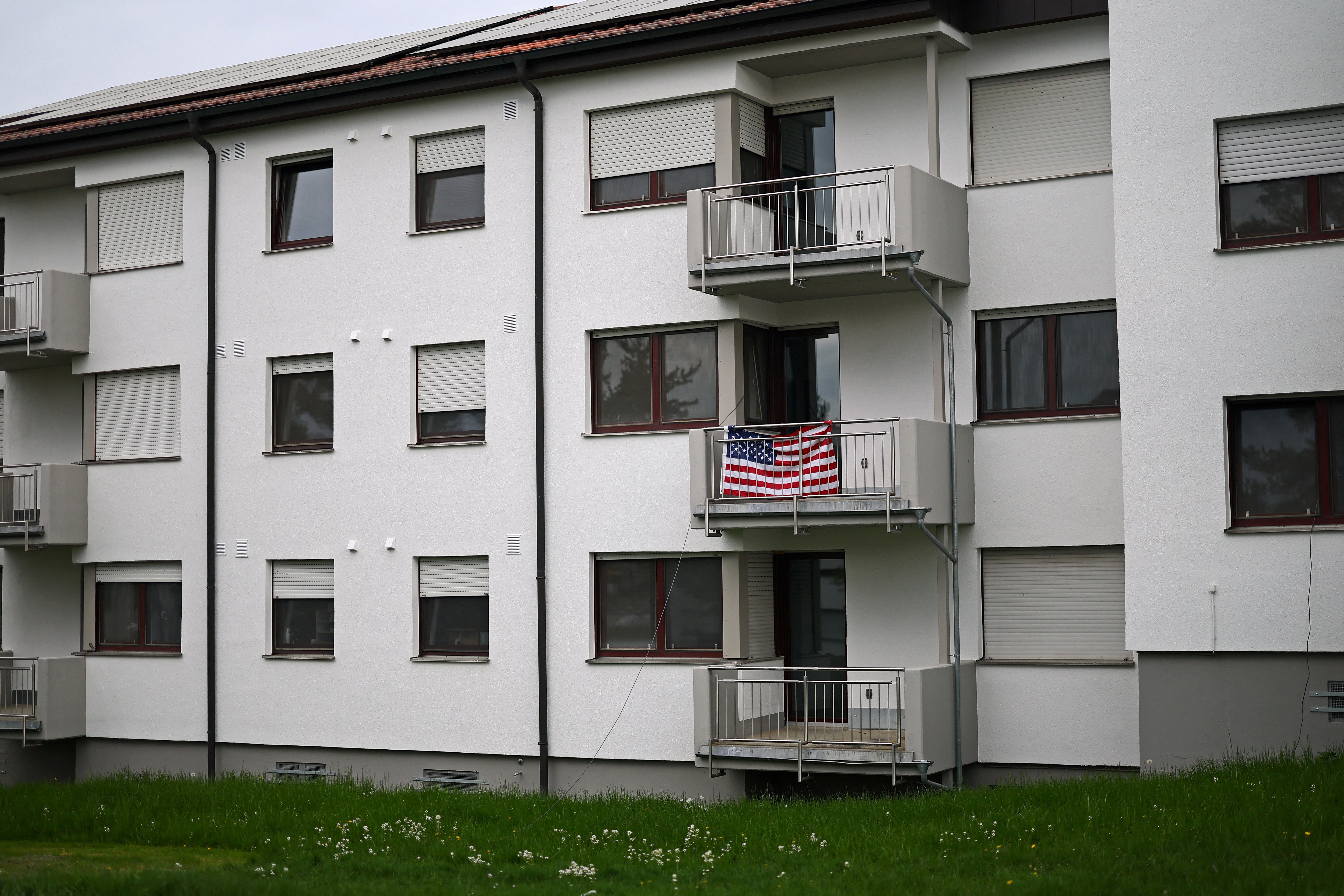A national flag of the U.S. drapes a balcony of an apartment block where personnel of the U.S. military reside in Vilseck, Germany, May 4, 2026