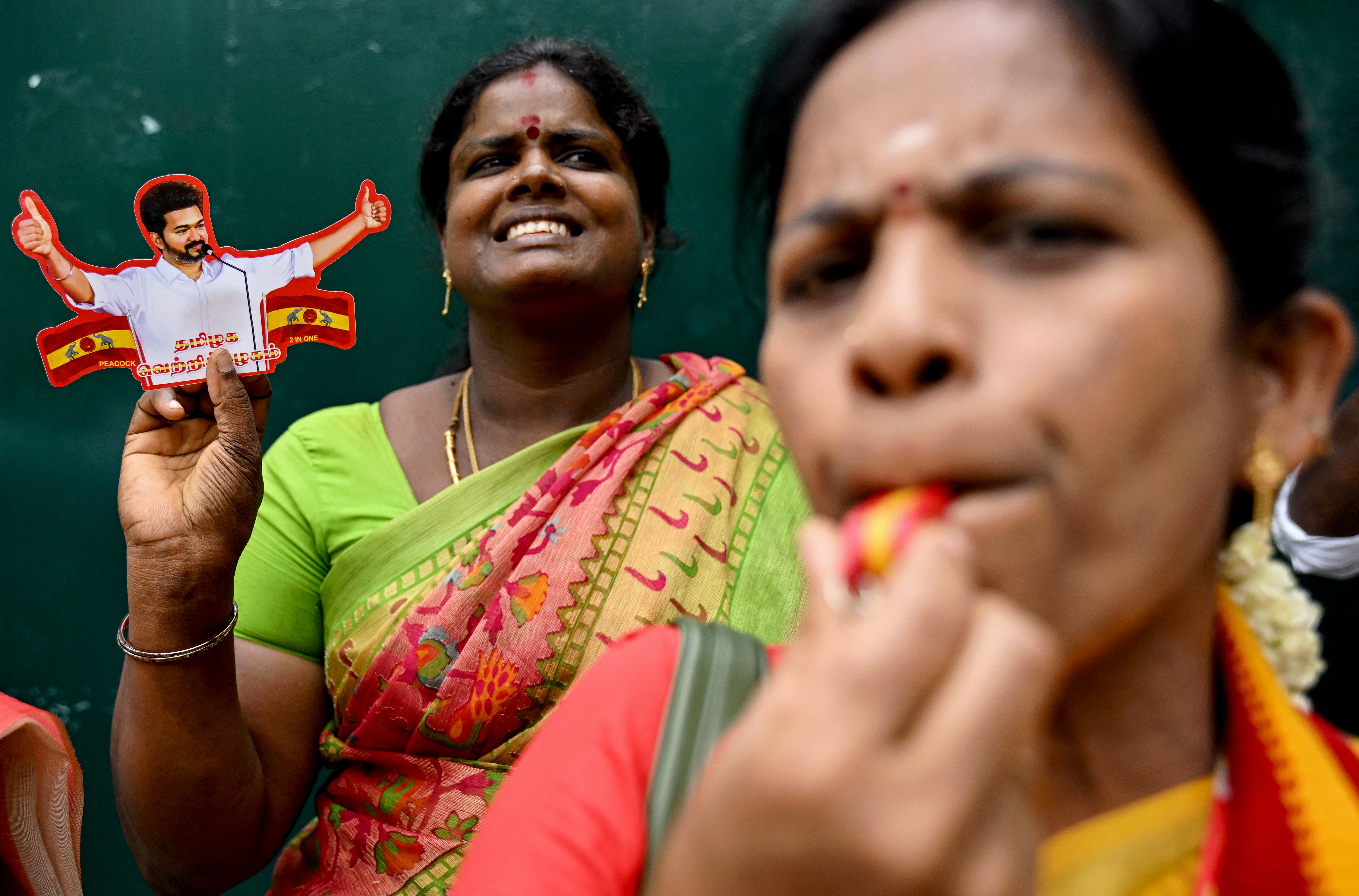 Tamilaga Vettri Kazhagam members celebrate during the counting of votes in Chennai on 4 May 2026