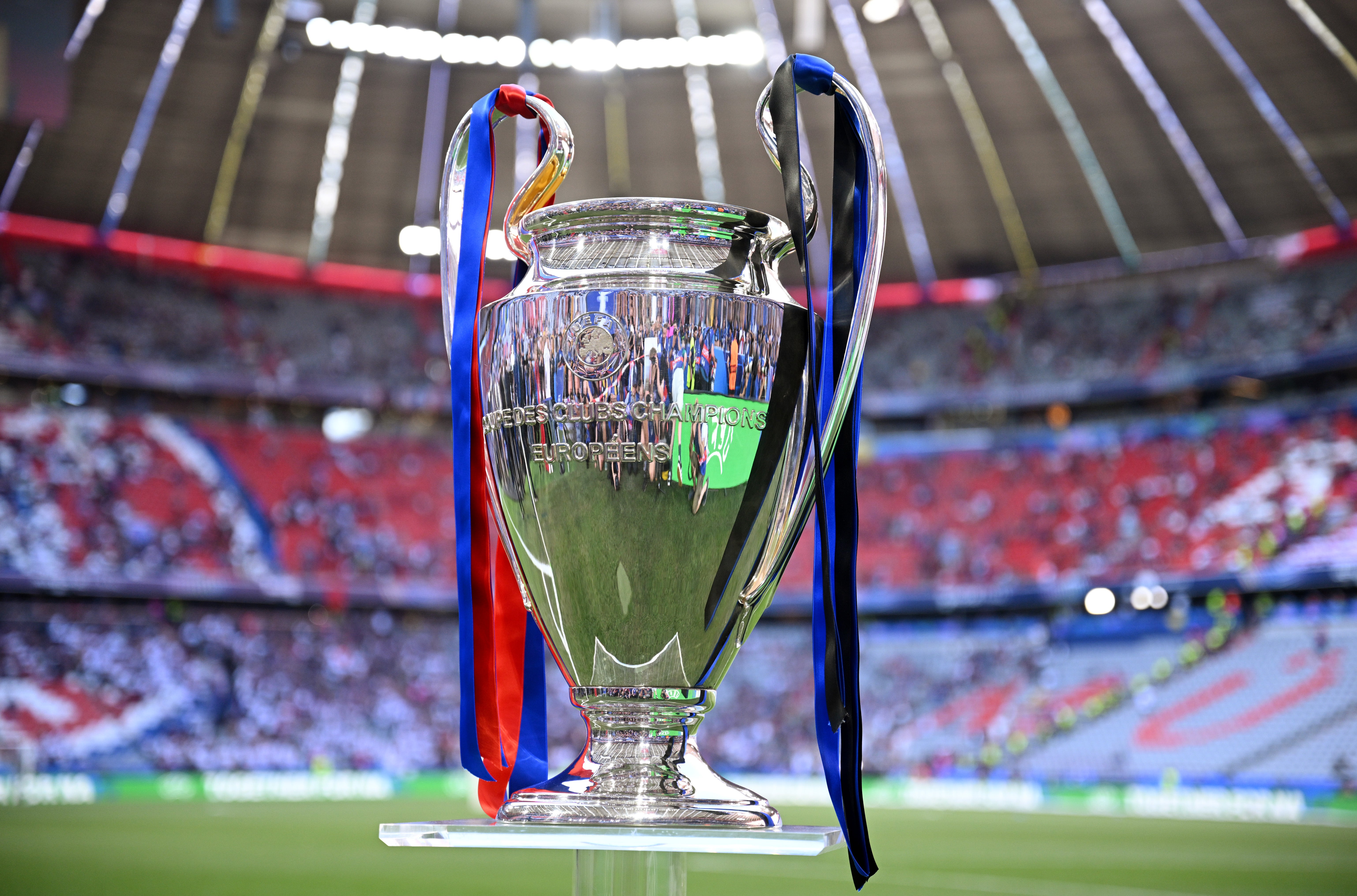 Draw bowl with white balls during the 2026/27 UEFA Champions League league phase draw ceremony, with the competition logo in the background.