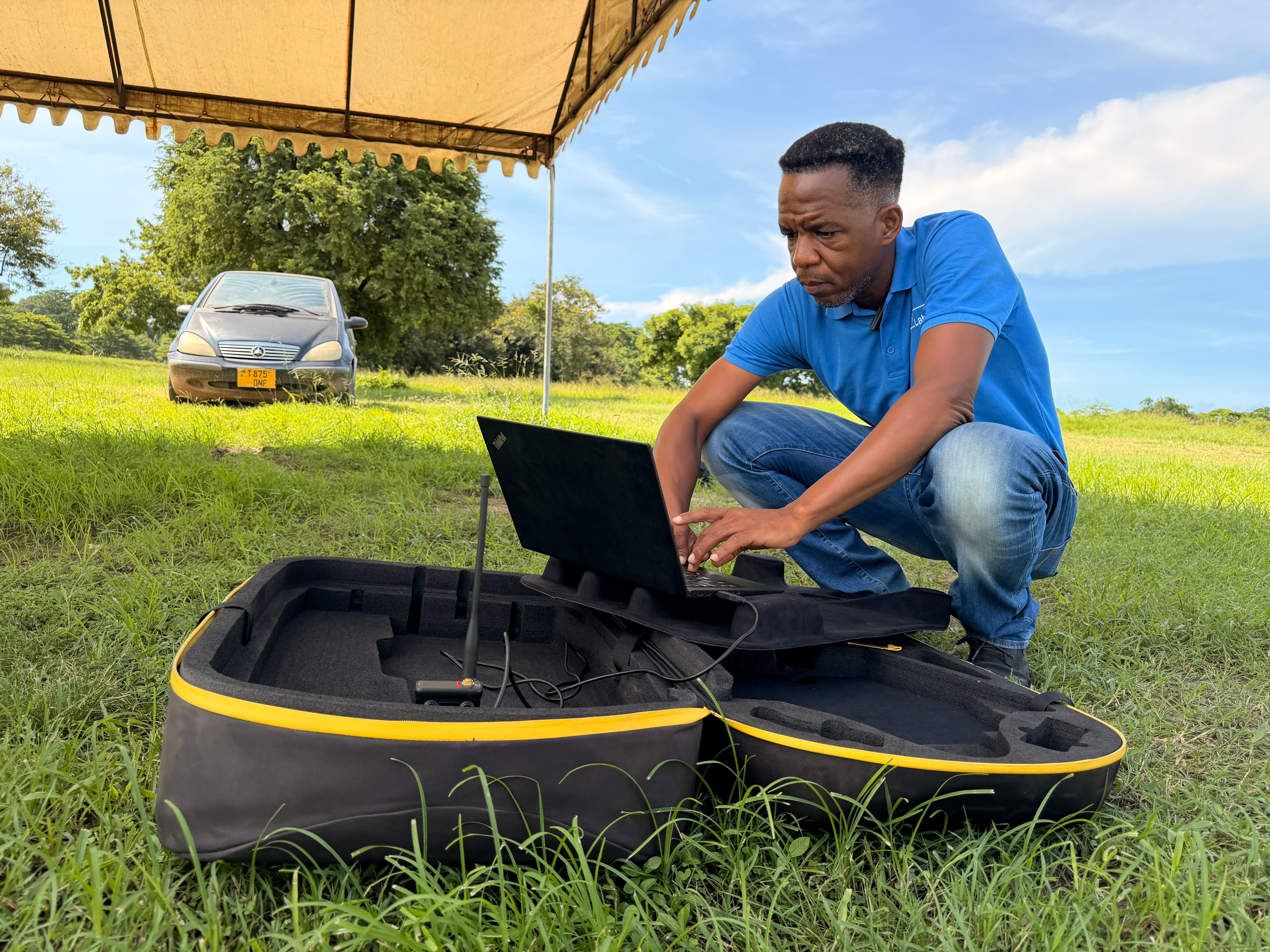 Leka controls the Swiss-made drone from his laptop has it circles above, taking photographs