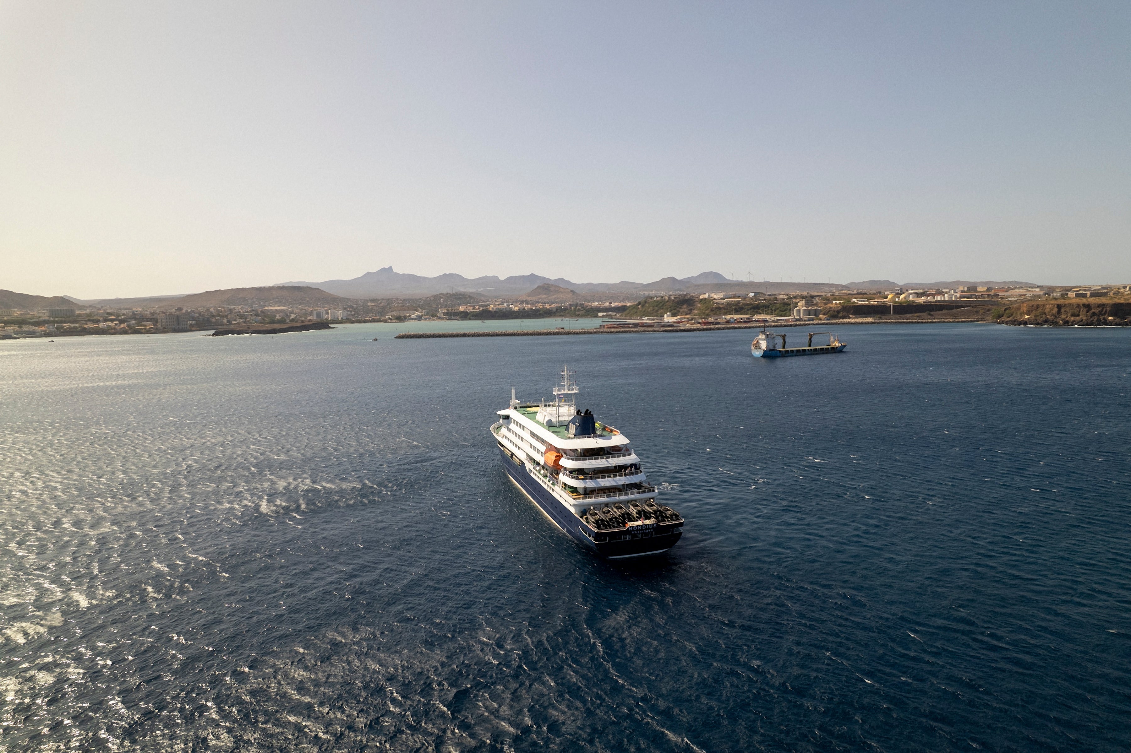This aerial image shows a general view of the cruise ship MV Hondius standing off the port of Praia, the capital of Cape Verde.