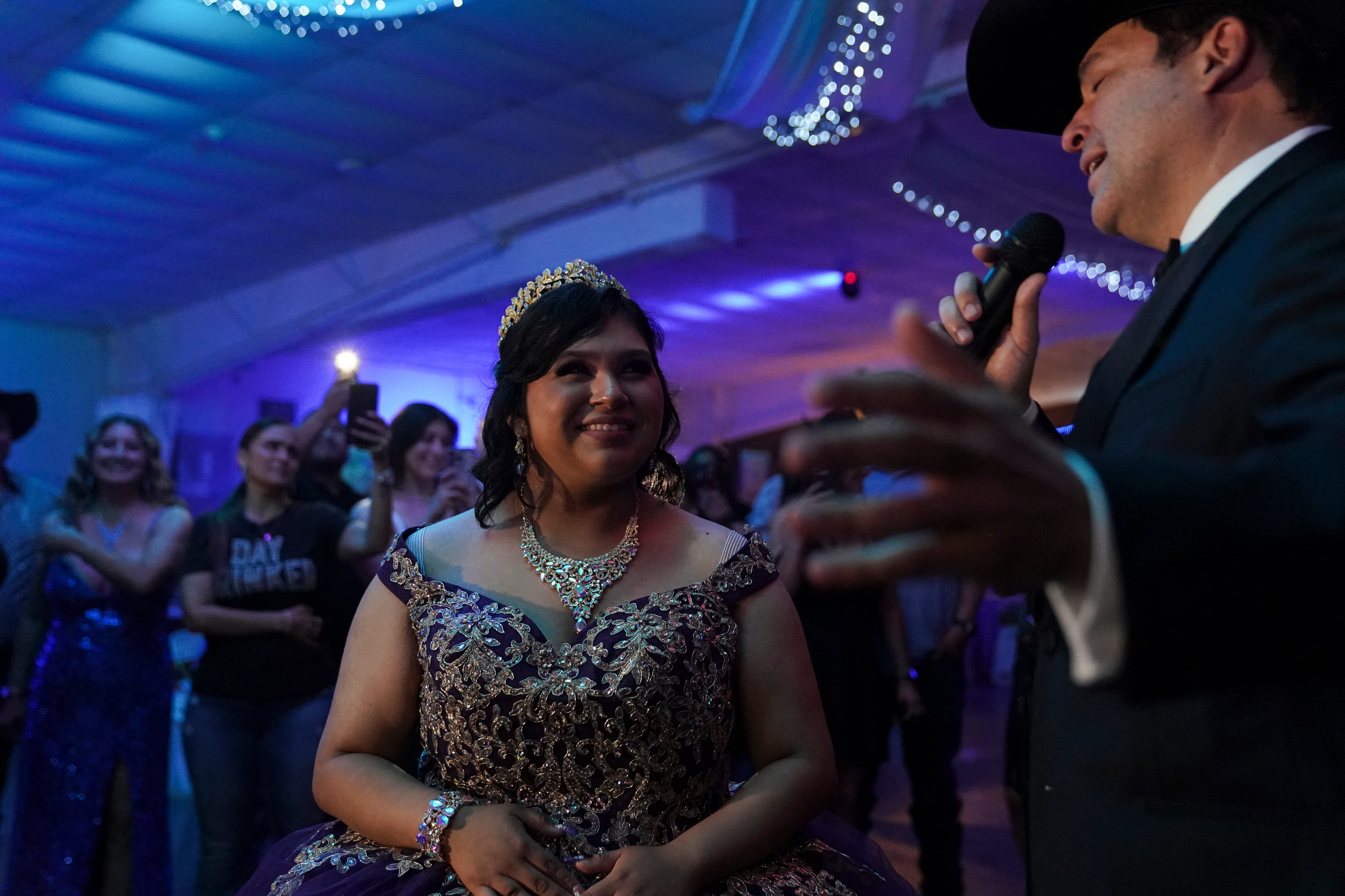 Latin Grammy winner and Democrat candidate for Texas' 15th Congressional District Bobby Pulido, sings to Melanie Nieto, 15, at her quinceanera party in Edinburg, Texas, on March 14, 2026. (Photo by Gabriel V. Cardenas / POOL / AFP via Getty Images)