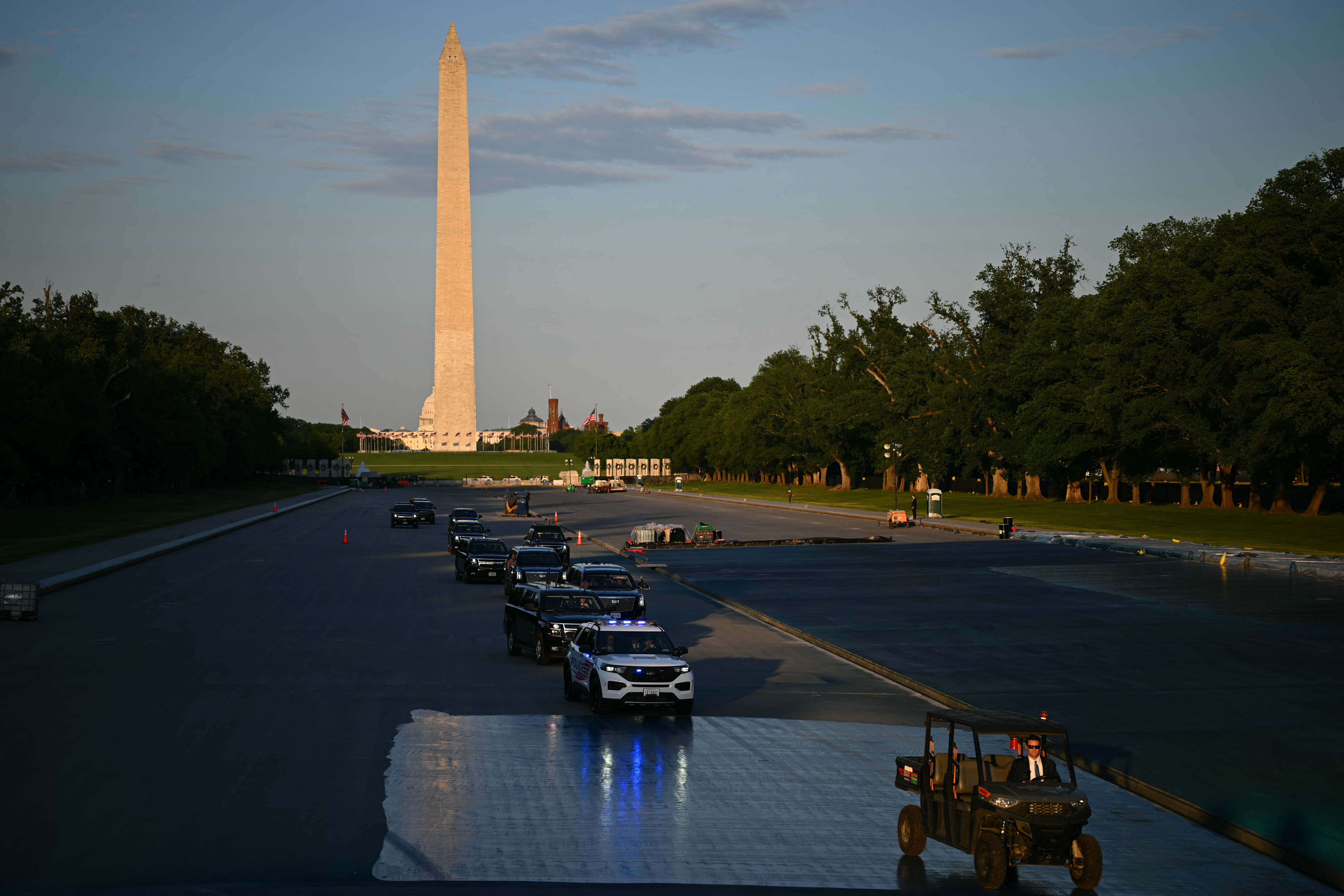 President Trump’s motorcade drove across the reflecting pool Friday to review the newly-painted basin