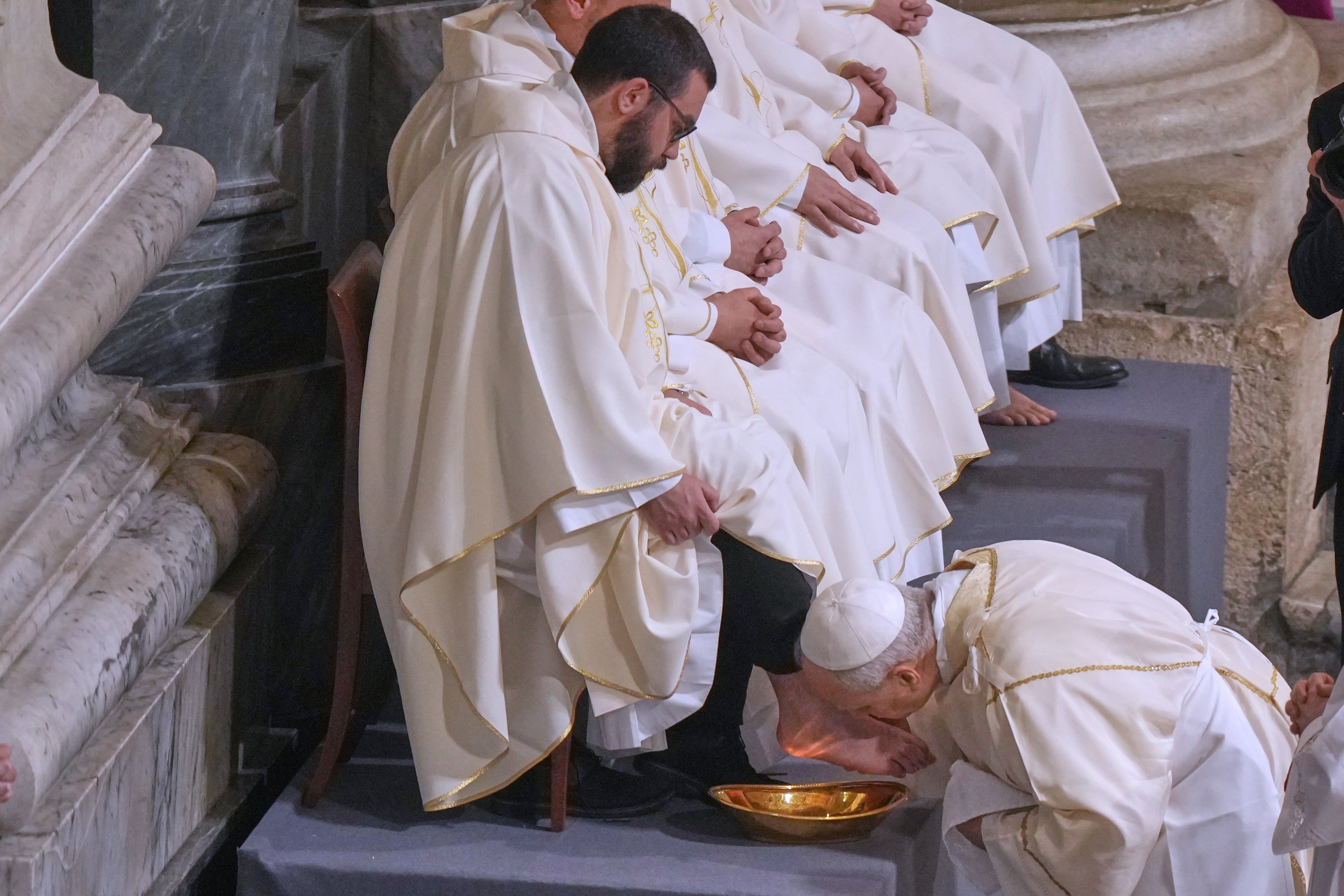 Pope Leo XIV washes and kisses the feet of 12 Roman priests during the Missa in Caena Domini, the Mass of the Lord's Supper, on Catholic Holy Thursday in St. John Lateran Basilica in Rome, Thursday, April 2, 2026. (AP Photo/Andrew Medichini, File)