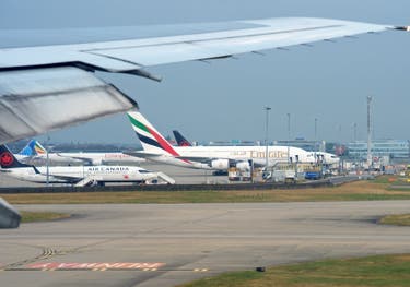 <p>Planes on the tarmac at Heathrow Airport Terminal 5</p>