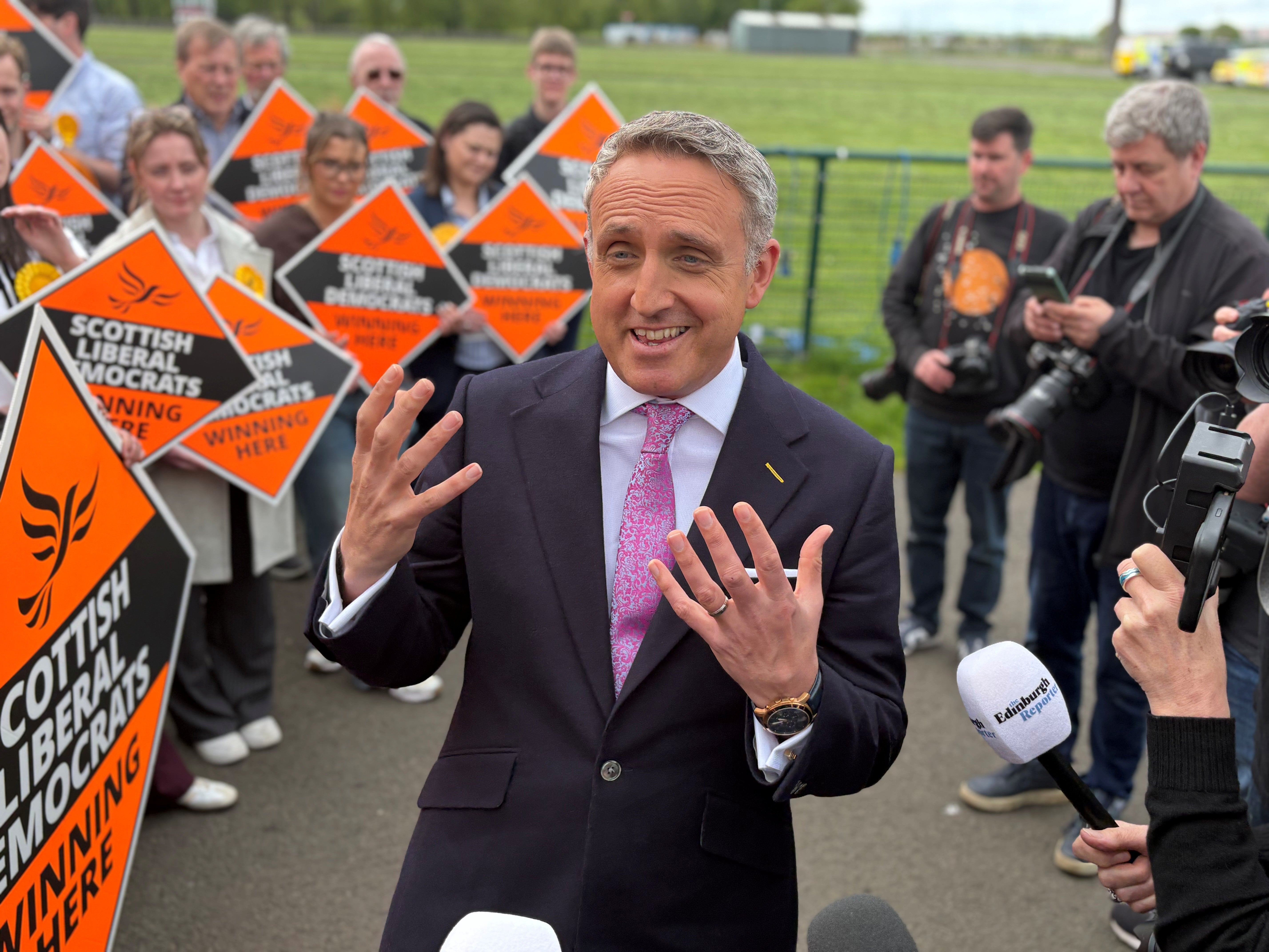 Alex Cole-Hamilton was in upbeat mood as he arrived at the Edinburgh election count (David Young/PA)