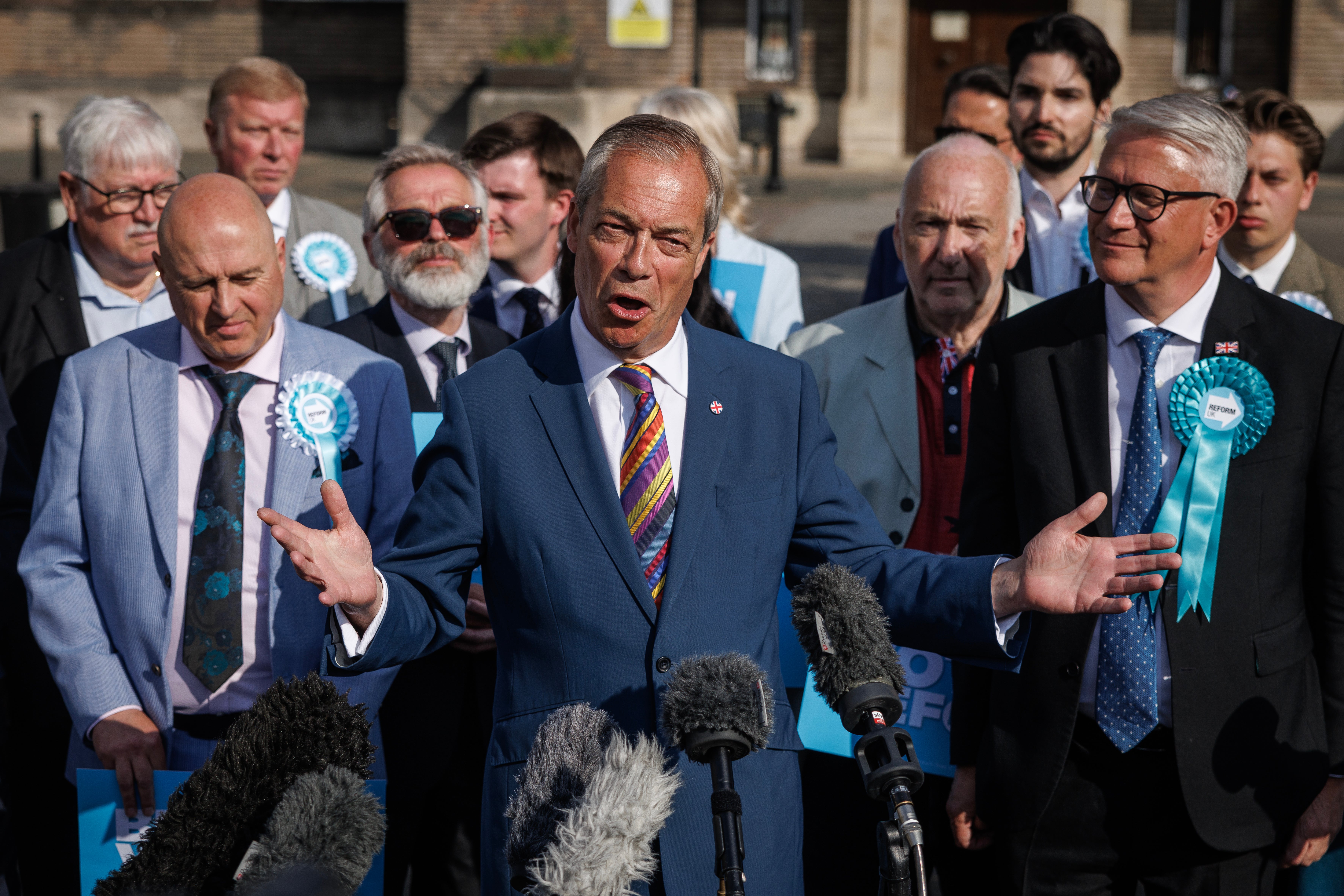 Slick hair, healthy complexion, rainbow tie… Reform UK leader Nigel Farage has had a distinctly Blairite rebrand‘